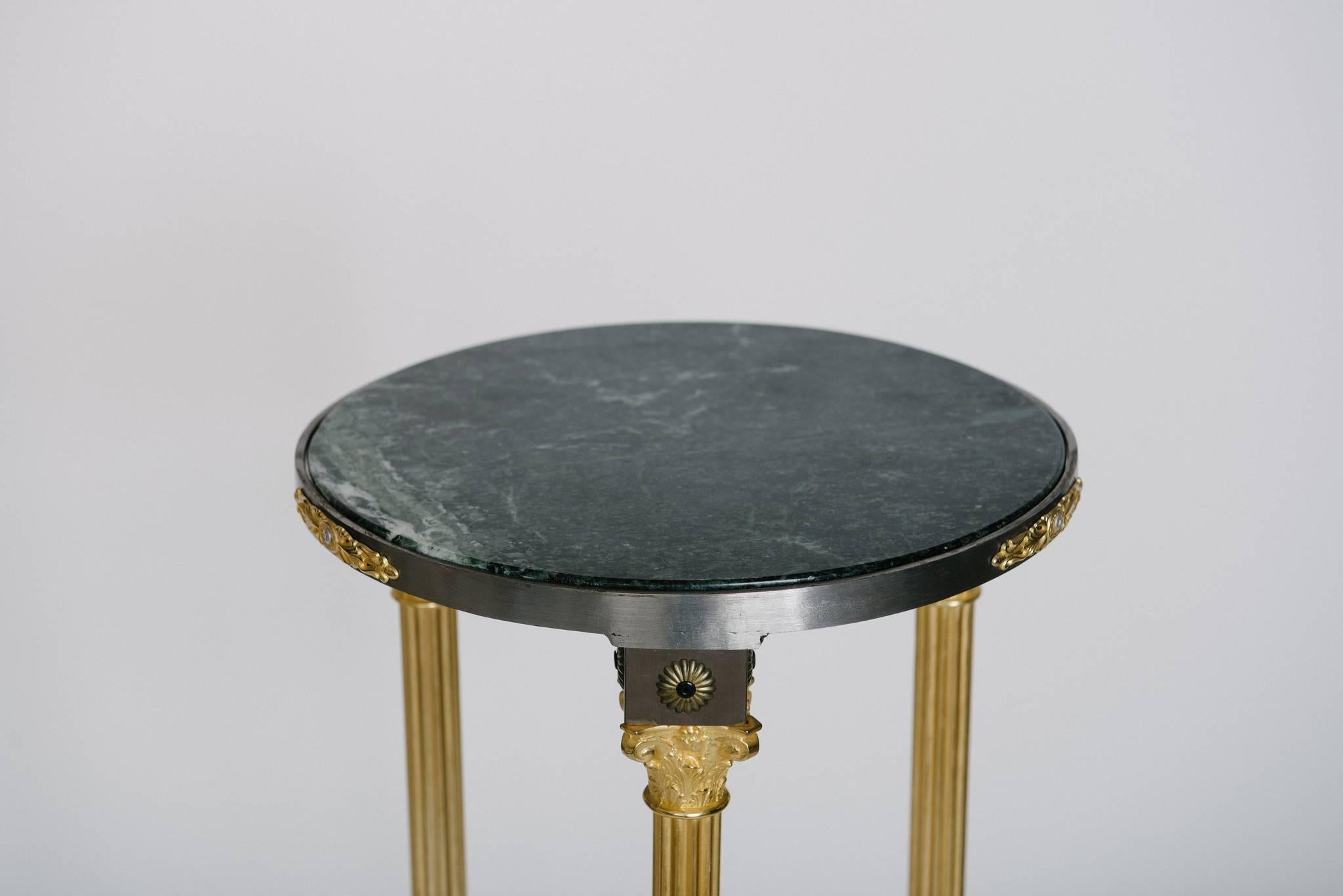 A vintage stainless and brass Maison Jansen style pedestal with marble top.
