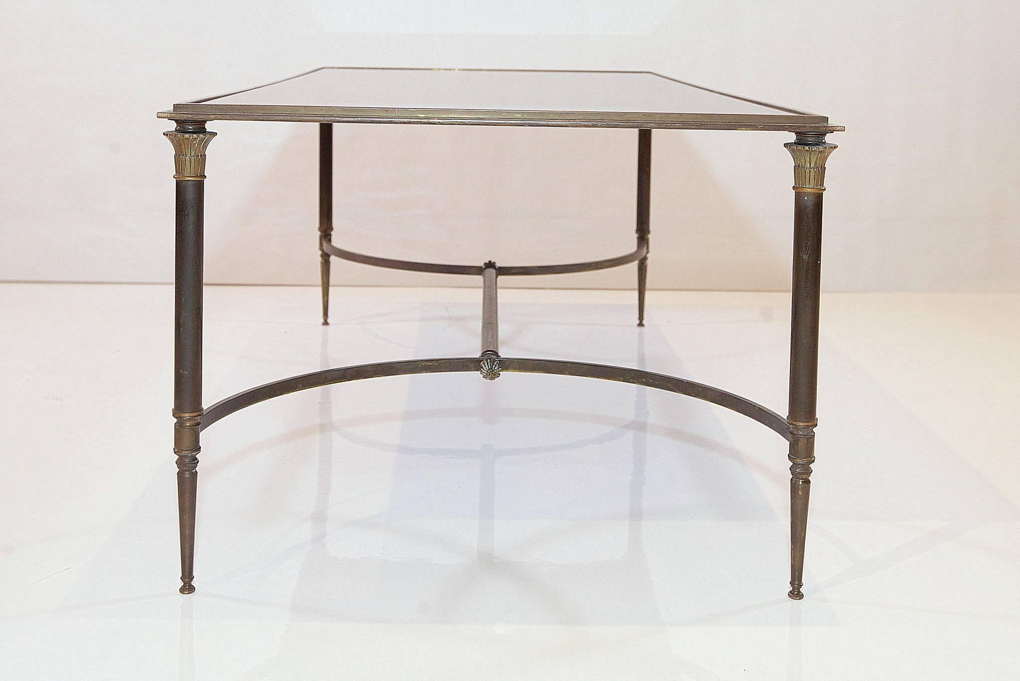 French Maison Jansen style bronze cocktail table with mirrored top, circa 1960.