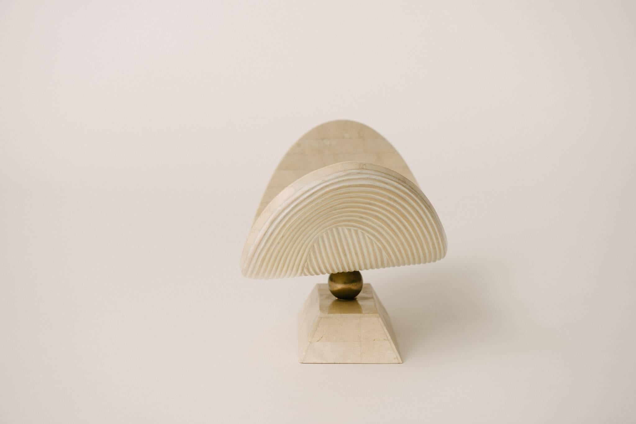Tessellated polished stone and brass table sculpture.