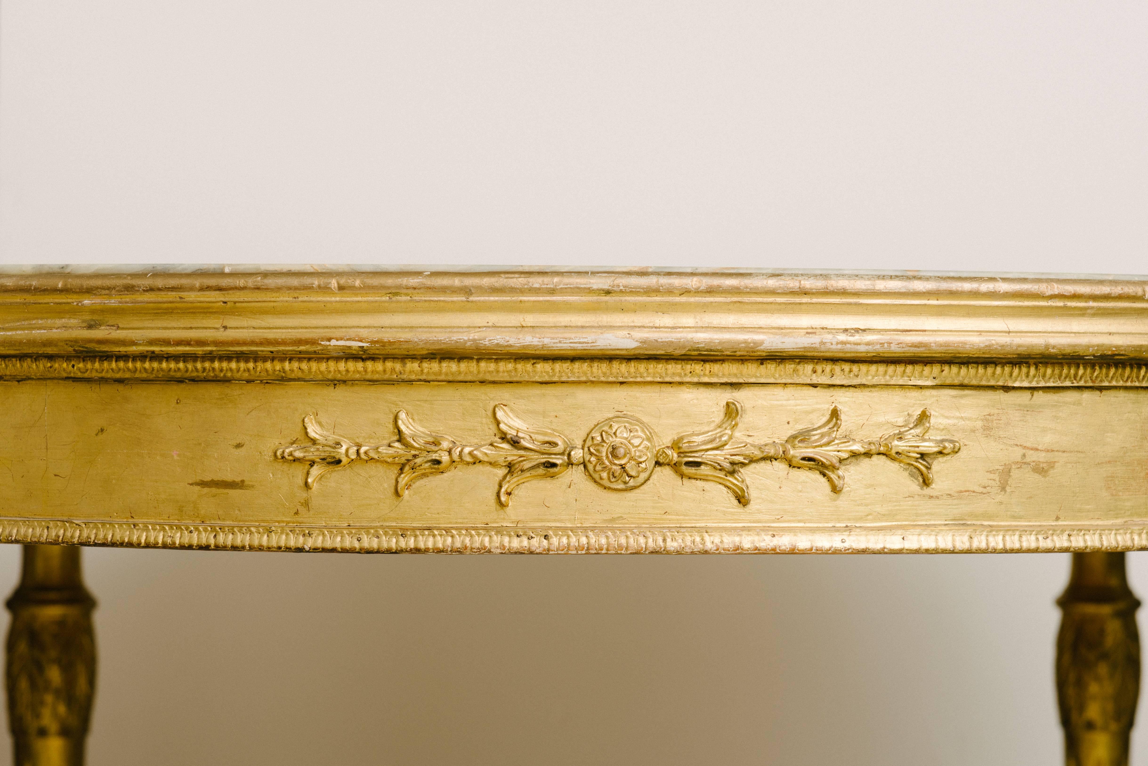 19th century Italian Louis XVI style giltwood center table with original onyx top.