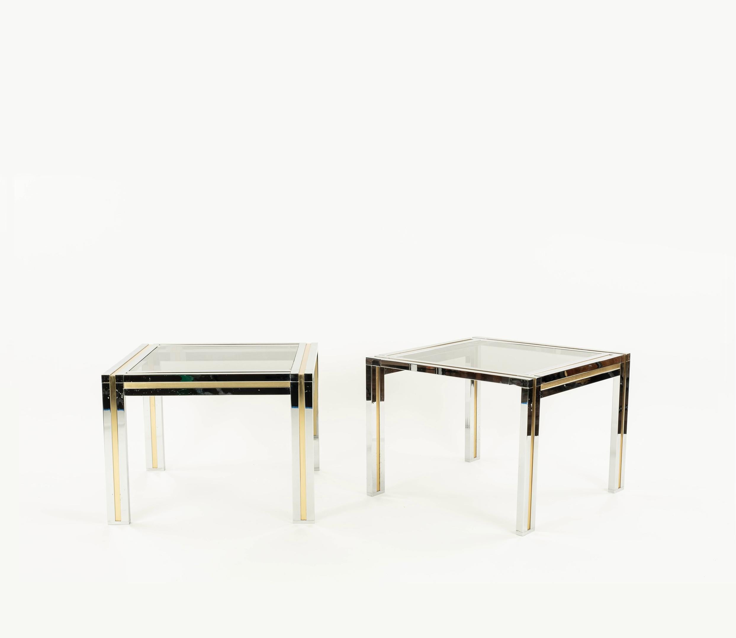 Pair of brass and chrome side tables in the style of Willy Rizzo with glass tops.