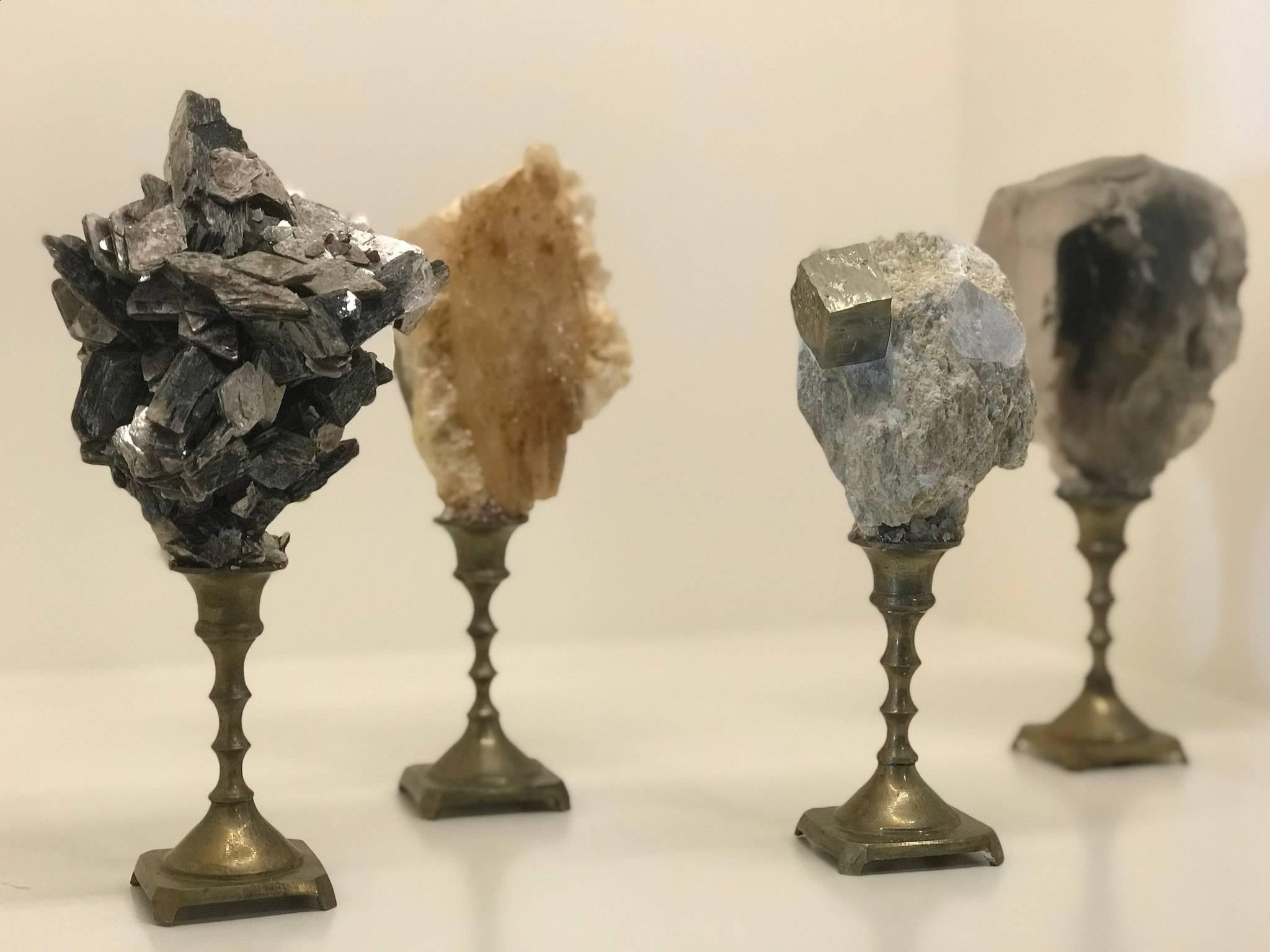 A handsome display of earth’s most breathtaking examples of natural history that have formed over the past 450 million years. Four natural mineral specimens collected from around the world are mounted on vintage brass bases.
A wonderful set to add