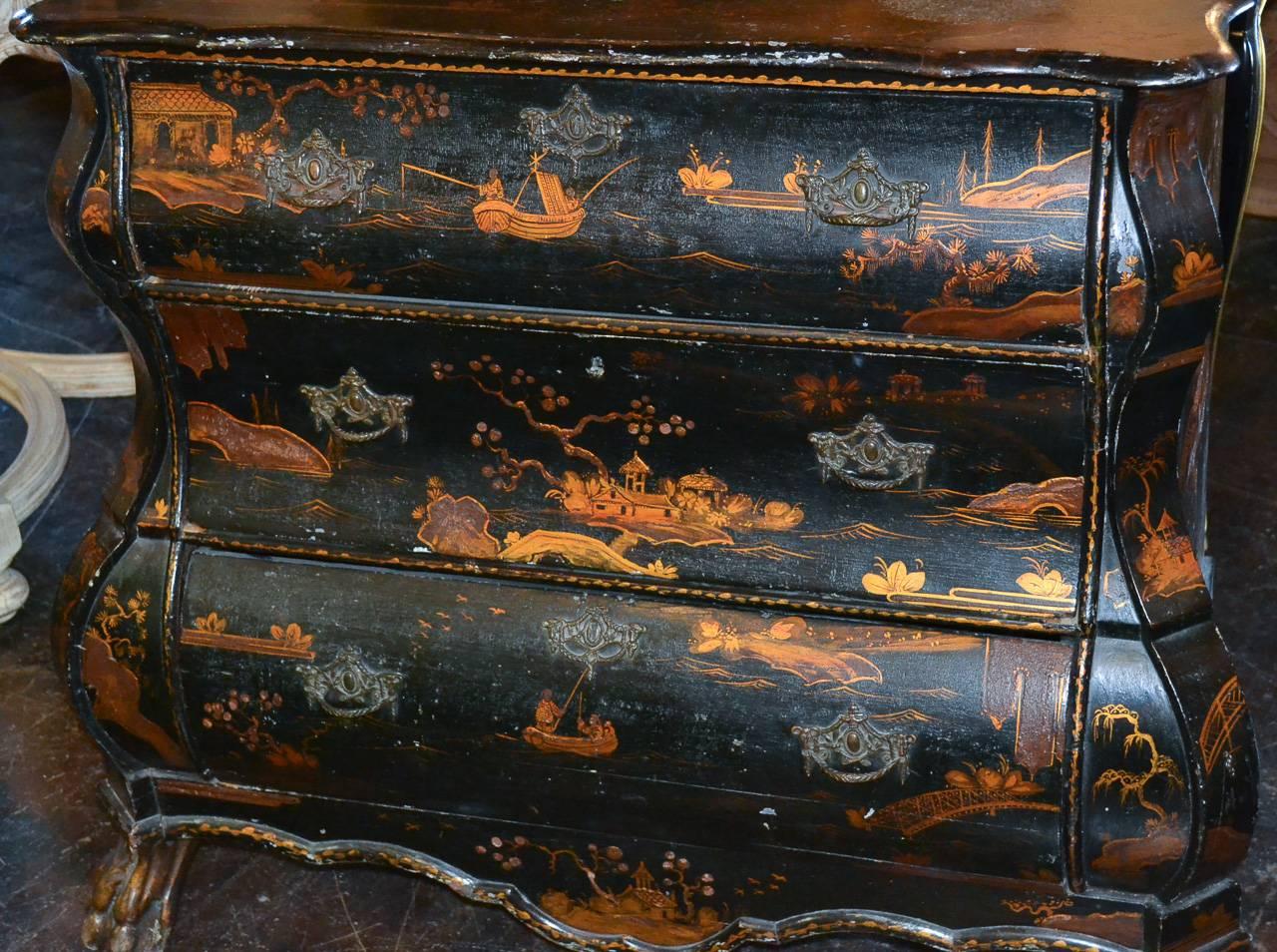 Splendid 18th century Dutch chinoiserie three-drawer shaped commode. Having lovely chinoiserie decorations on all sides in landscape motif, ornate bronze mounts and resting on claw feet. Exhibiting a time worn patina that offers rich character and