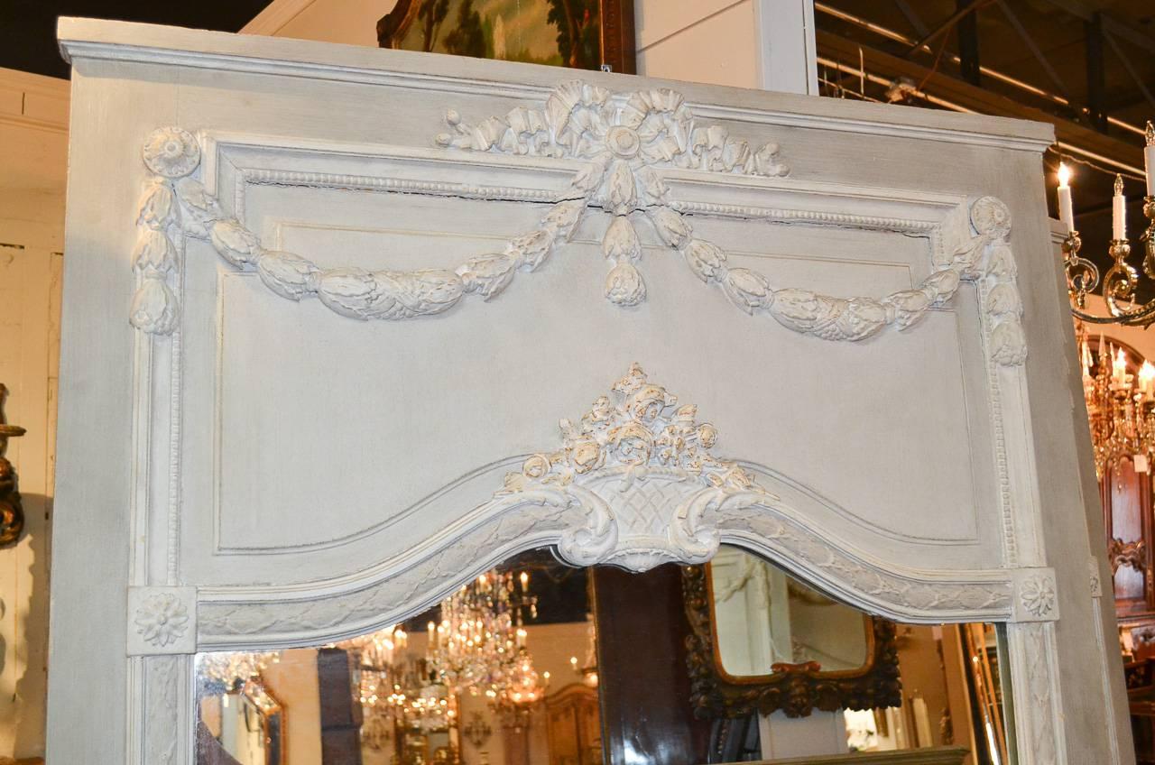 Superb pair of large 19th century French painted mirrors. Having beautifully carved details in swag and acanthus leaf motif, and showcasing a lovely and stylish painted finish.