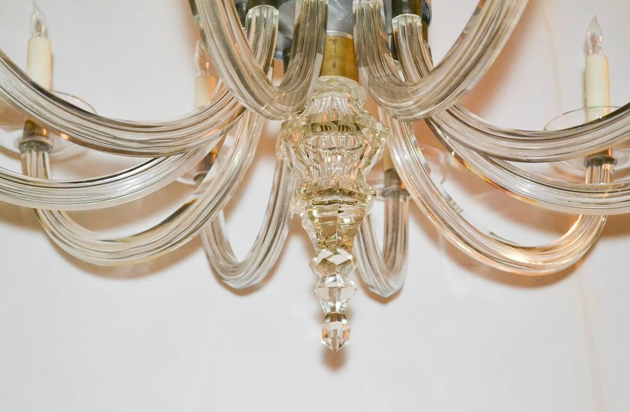 Marvelous French Mid-Century heavy glass ten-light chandelier. Having gracefully curved arms, unique central column, and stylish lines. Beyond chic for numerous designs!