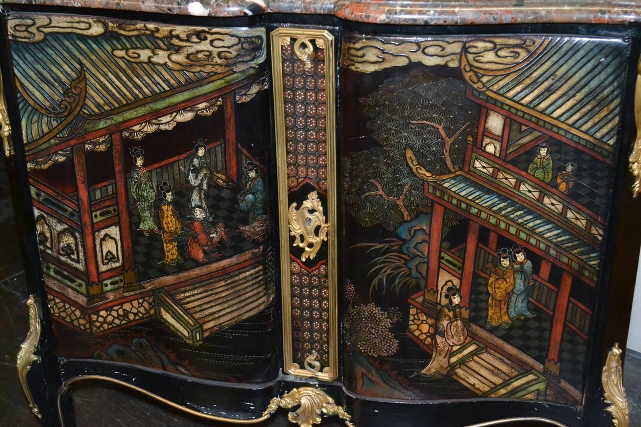 Stunning 19th century French Belle Époque Coromandel two-door lacquered server. Having vibrant courtyard scene across shaped door fronts, Fine gilt bronze mounts, and Breche Nouvelle marble top. Wonderful for numerous designs!