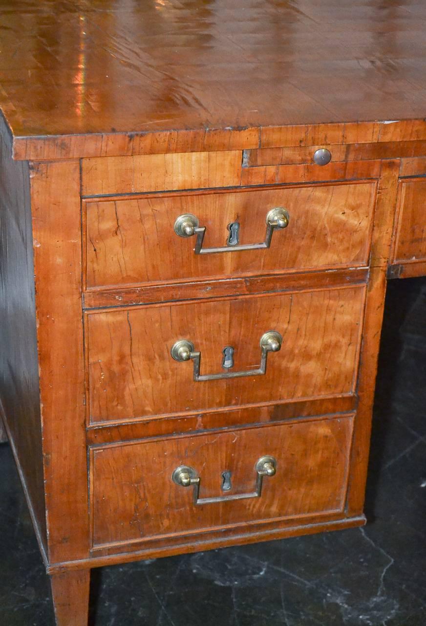 Fantastic 19th century French Directoire walnut partners desk. Having seven working drawers, nice bronze hardware, and leather-topped writing slide.
Exhibiting a beautiful aged patina and clean lines that suit a variety of decorative styles!