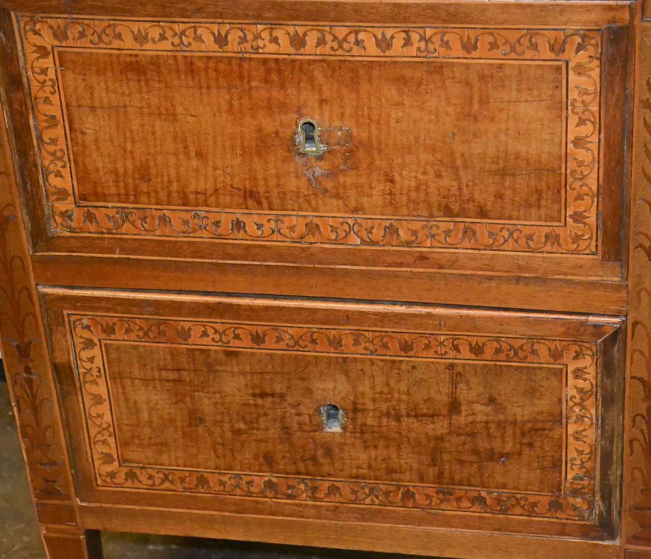 Lovely 18th century Italian inlaid two-drawer chest with Breche d'Alep marble top. Having wonderful detailed foliate inlays across drawers fronts and sides, resting on tapered legs, and exhibiting clean lines that work in countless styles of decor!