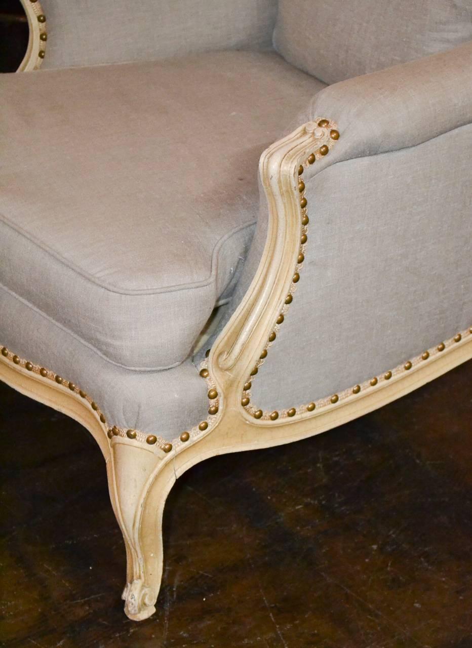 Great pair of French bergeres with lacquered finish. Having excellent size and proportion and resting on cabriole legs. Ready for your designer touch.
