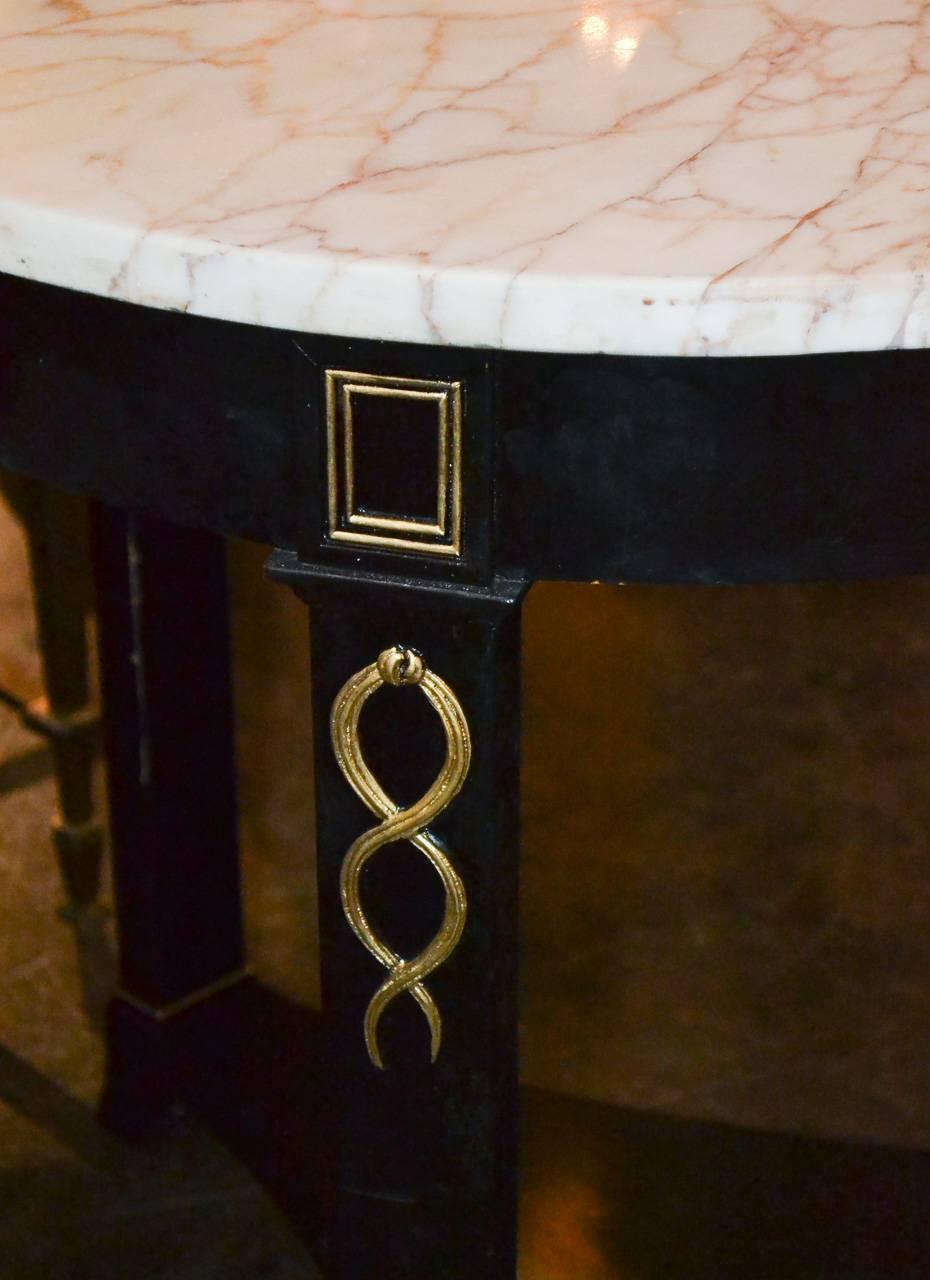 Nice pair of French Jansen black lacquered side tables. Having lovely parcel-gilt trim, deep black finish and Skyros marble tops. Beyond chic for numerous designs!