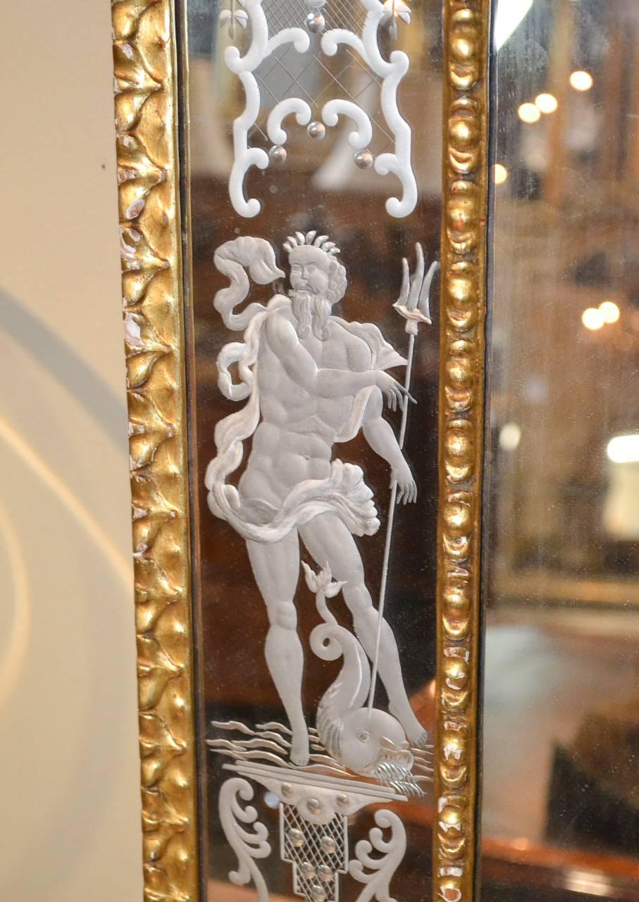 Gorgeous pair of etched Venetian mirrors, circa 1925. Having wonderful etched figures of Neptune and Venus, various urn and floral motif etchings, and surrounded by lovely gilt frames. Perfect for today's stylish decors!