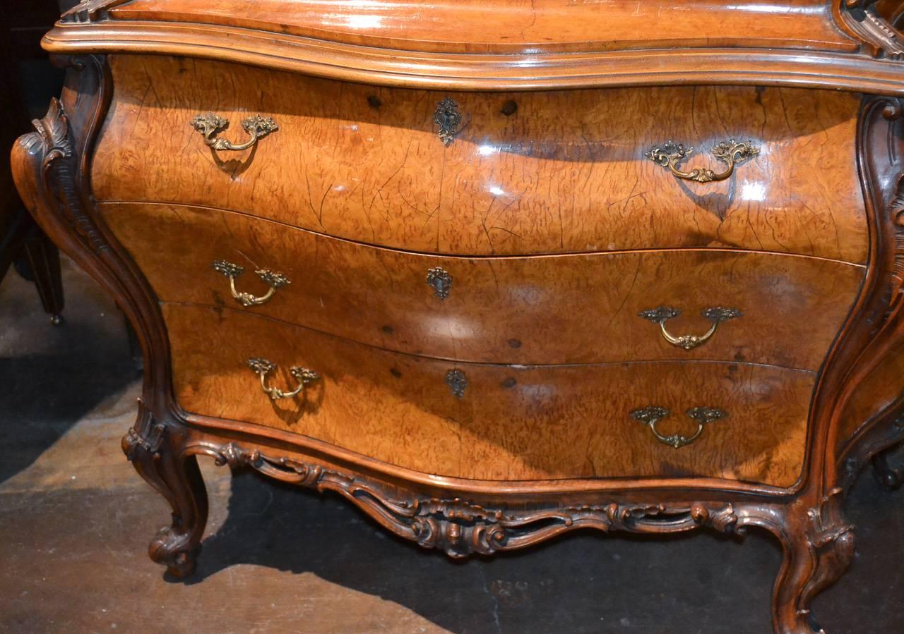 Great Italian burl walnut bombe form three-drawer bureau. Having a beautiful rich warm patina, excellent shaped and carved form, and interior with fitted drawers. A charming piece and worthy of any design!