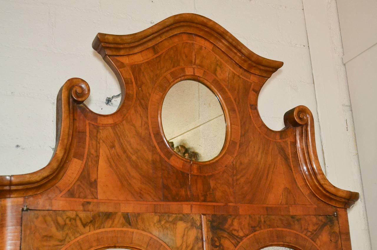 Sensational antique Italian burl walnut three-drawer secretary. Having lovely mirrored pediment, shaped drawer fronts, fitted interior, and gorgeous warm patina. A fantastic piece to suit many types of decor!