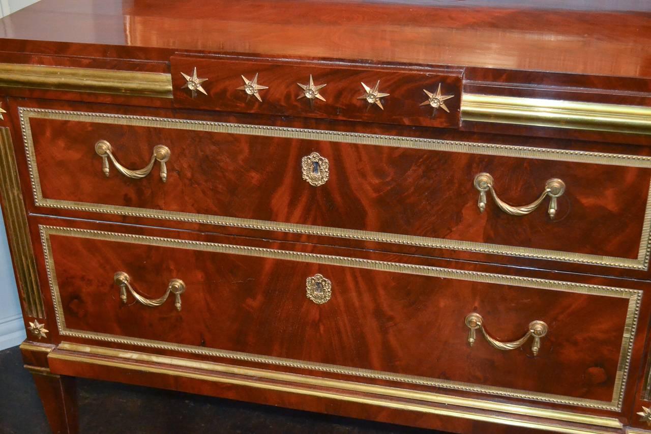 Stately Russian flame mahogany two-drawer commode, circa 1860. Having lustrous gilt bronze mounts, a rich warm patina, and resting on tapered legs with sabots. Please view all pictures to enjoy, serious inquiries are welcome!