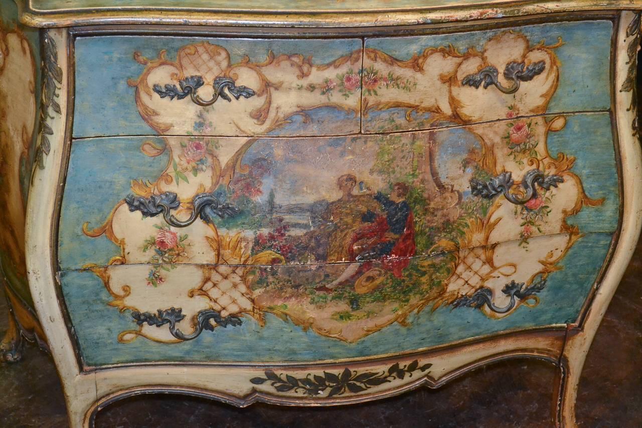 Fantastic French painted Bombe shaped four-drawer commode. Beautifully painted with courting scene and floral motifs. Having a gorgeous color palette, bronze hardware in detailed acanthus leaf motif and lovely time worn patina. Fabulous for numerous