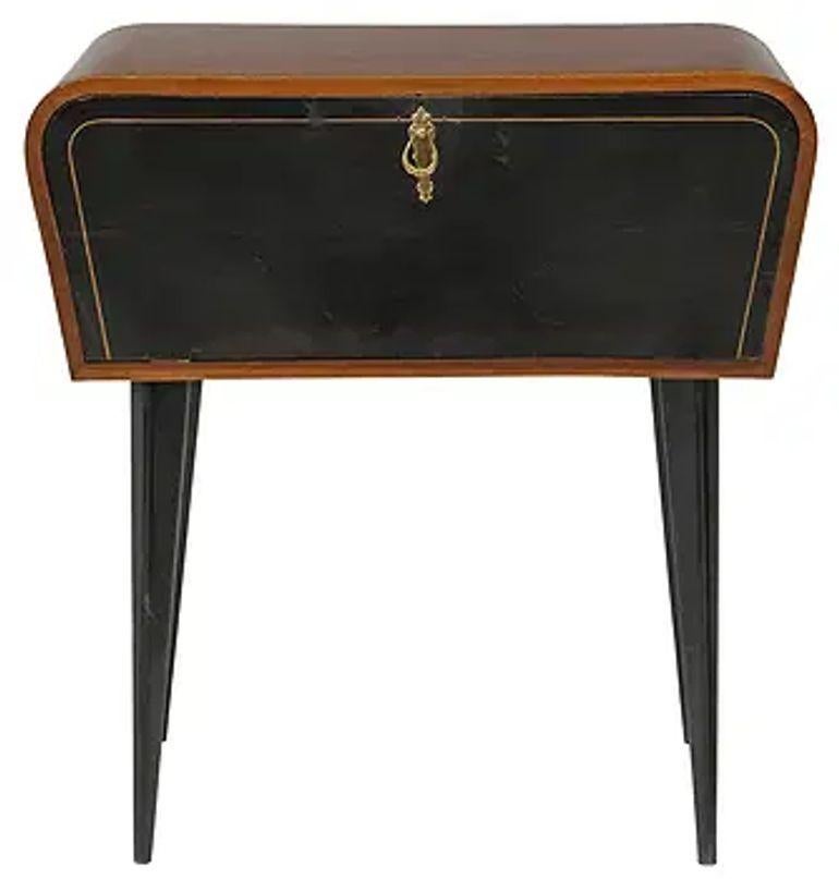 The Italian Mid Century Mahogany Side Table with Ebonized Front is a stylish and elegant piece of furniture. Made from high-quality mahogany, the ebonized front adds a touch of sophistication to the design. This side table is perfect for adding a
