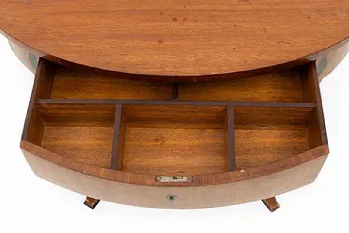 This 19th century Austrian mahogany oval Biedermeier table is a luxurious and elegant piece of furniture for any home. Its sturdy construction and beautiful classic design make it a standout piece that will be cherished for generations to come.