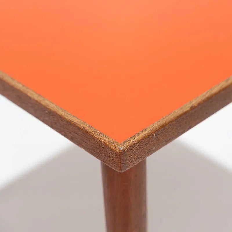 This set of three Danish mid-century modern side tables with a laminate top features a sleek and stylish design that perfectly captures the essence of the era.  Made of teak with a laminate top. Stamped Hans C. Anderson. Perfect for adding a retro