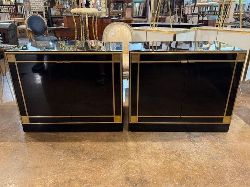 Good pair of Pierre Cardin manner piano black and brass side cabinets. Side cabinets in the manner of Pierre Cardin are all about sleek geometry and high-impact finishes. 35.5W x 22D x 29H