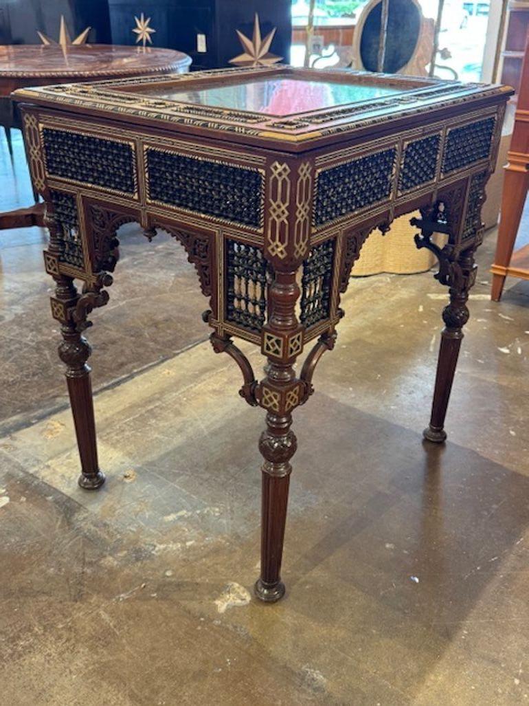Rare early 20th century fine quality Syrian carved vitrine table. Vitrine tables are exquisite showcases of Levantine craftsmanship, often featuring intricate marquetry, mother-of-pearl inlay, and geometric or arabesque motifs.  Circa 1920. 28.5w x