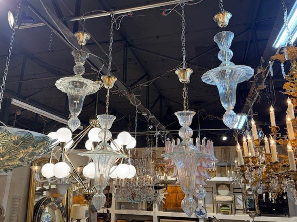 Decorative Clear Murano Glass lanterns in a bell shape.  A stylish choice for a fine home. Two available, priced each.
14w x 42h