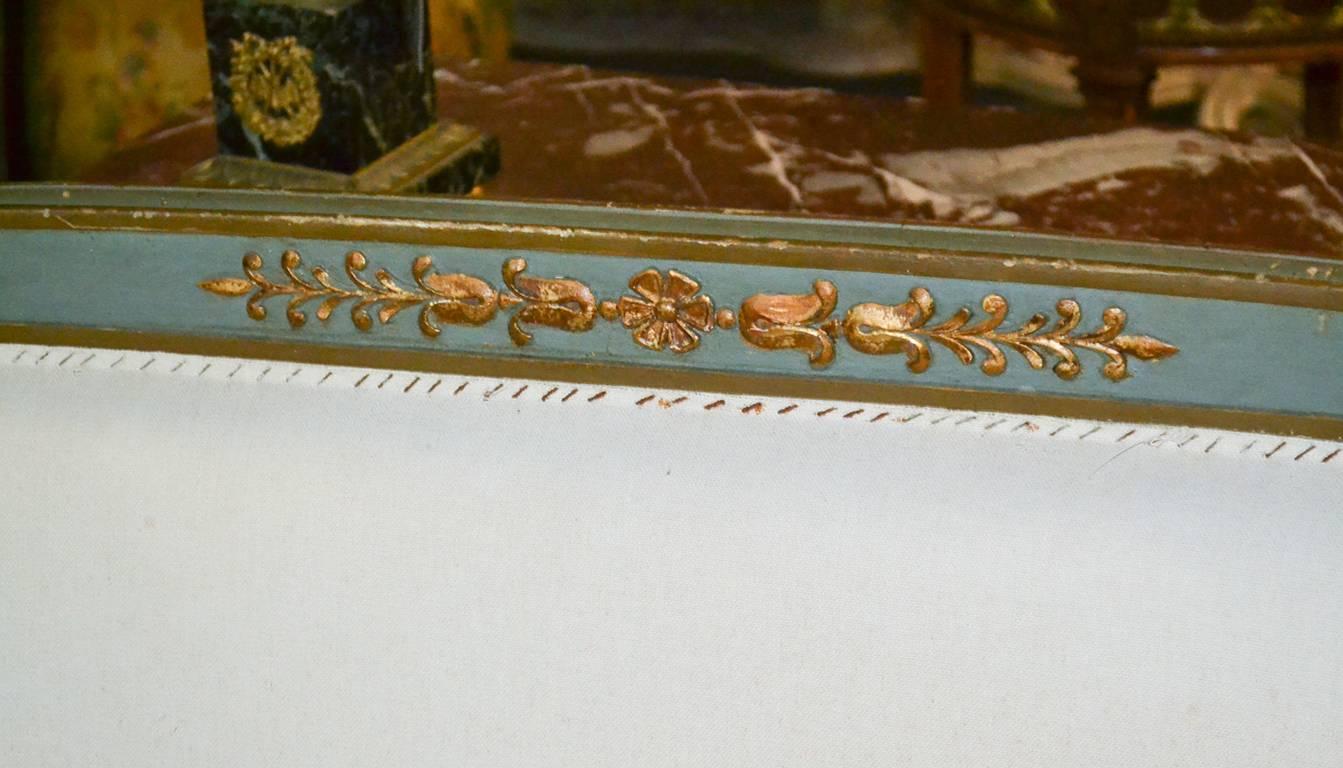 Splendid 19th century French Louis XVI painted and parcel-gilt settee. Having lovely floral and foliate motif carvings, arms and legs with acanthus leaf accents, and wonderfully aged painted finish.