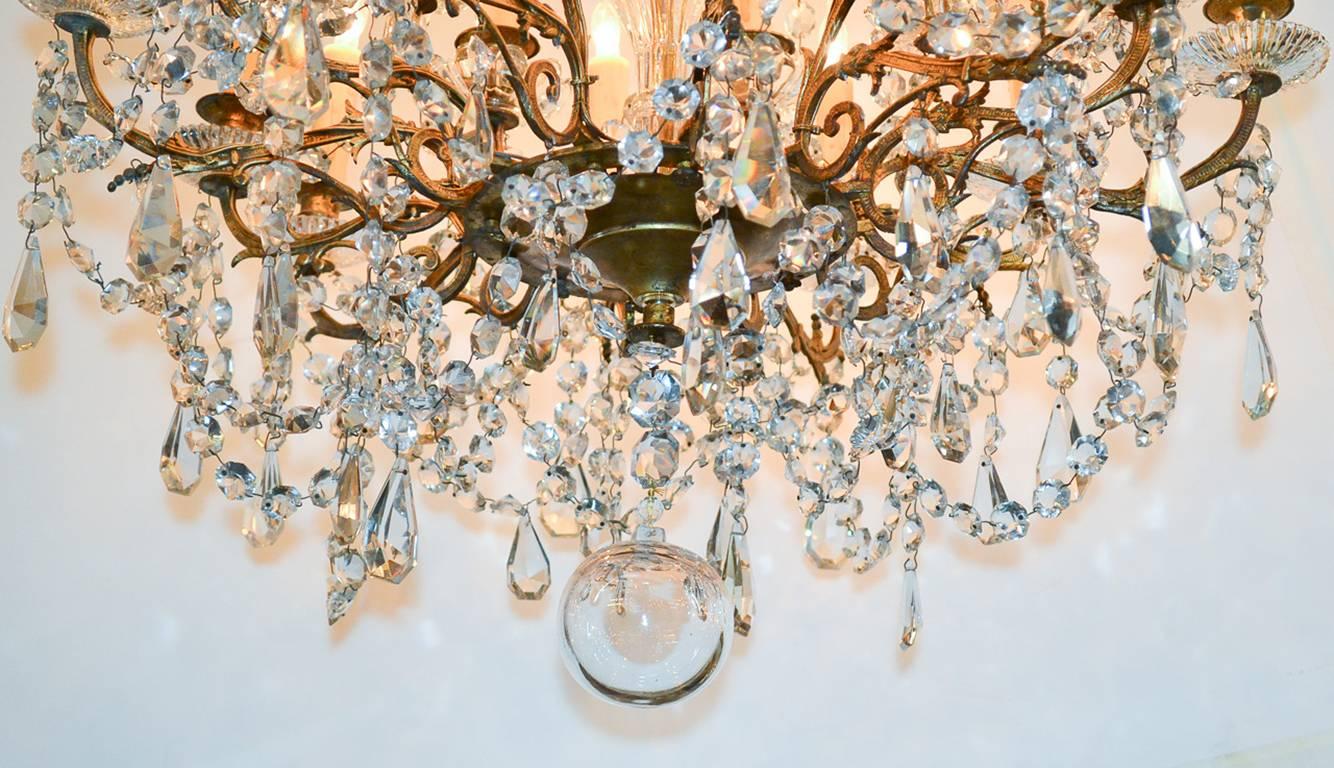 Exquisite 19th century French twenty-light bronze and crystal chandelier (possibly Baccarat). Beautifully draped and adorned with thick beaded crystal strands and drop prisms.