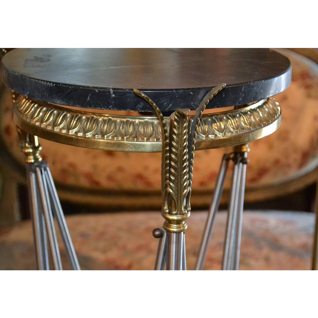 Striking polished steel and brass pedestal with a dark grey to blackish thick marble top. Highly sought after by designers,
circa 1940, France.
Measure: 46 inches height x 12 inches in diameter.