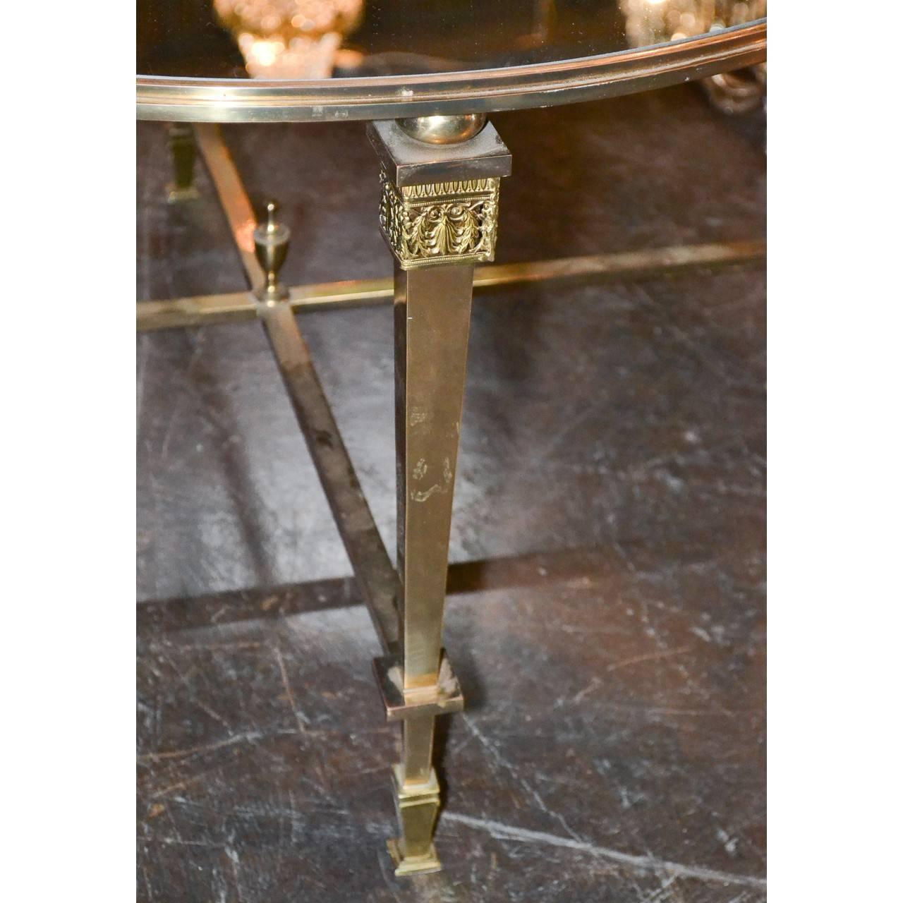 These midcentury neoclassic coffee/cocktail tables are high in demand today with decorators!
This beauty has a mirrored top, circa 1950.

Measure: 32.5 inches wide x 19 inches height.

 