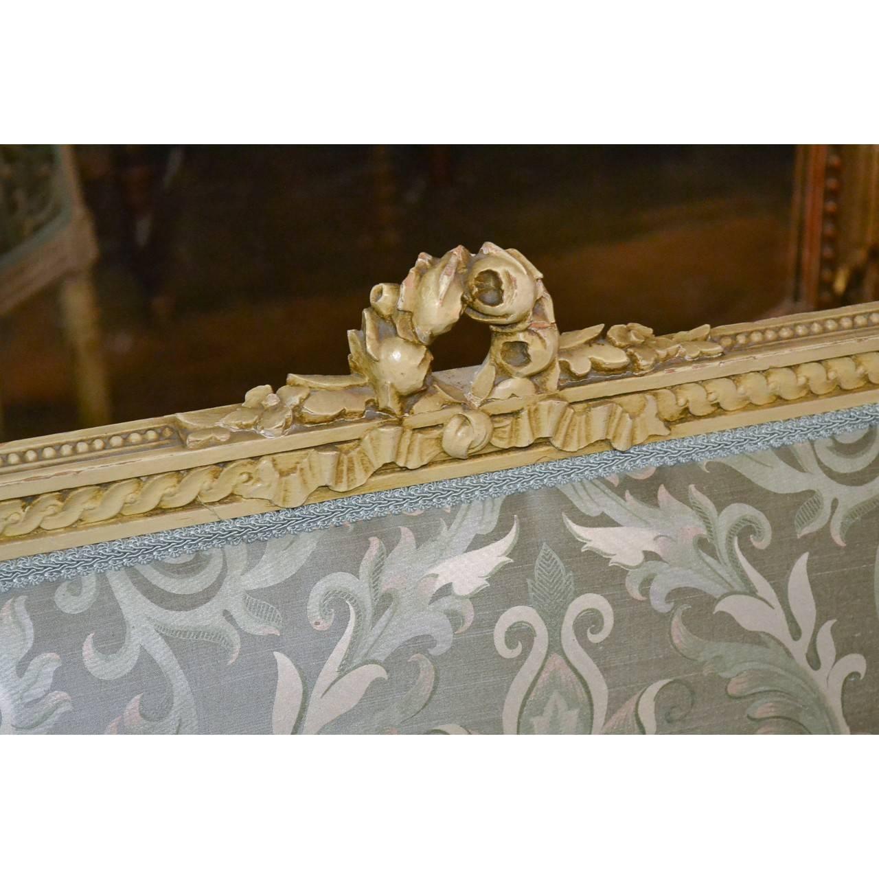 Gorgeous 19th century Louis XVI carved and painted settee with luxurious silk upholstery,

circa 1890

Measure: 63 inches wide x 21 inches deep x 32 inches height
top of seat cushion to floor is 14 inches
frame under cushion to floor is 11