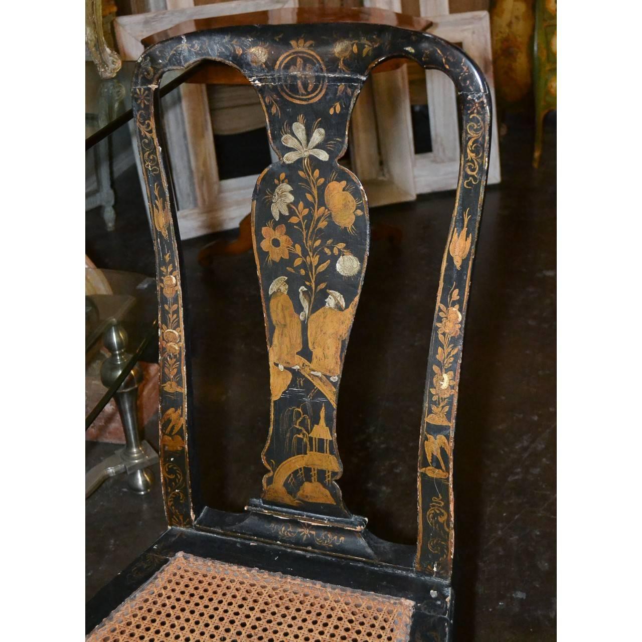 Remarkable pair of 18th century hand-painted armchairs with sought after cane seats. Made in England.