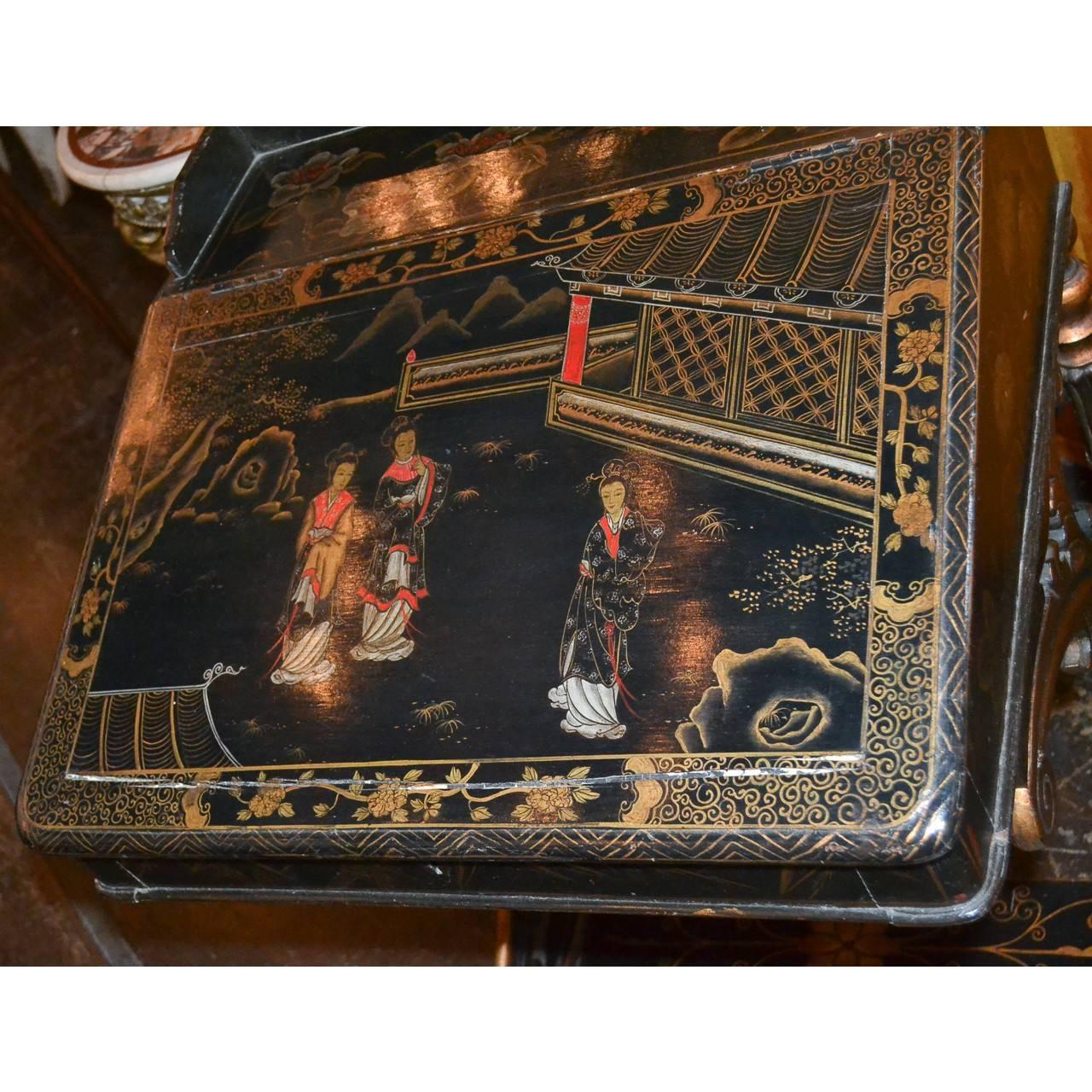 Interesting legs on this stunning English black lacquered chinoiserie Davenport desk.
A Davenport desk is a small desk that has a hinged lifting desktop,
circa 1880.