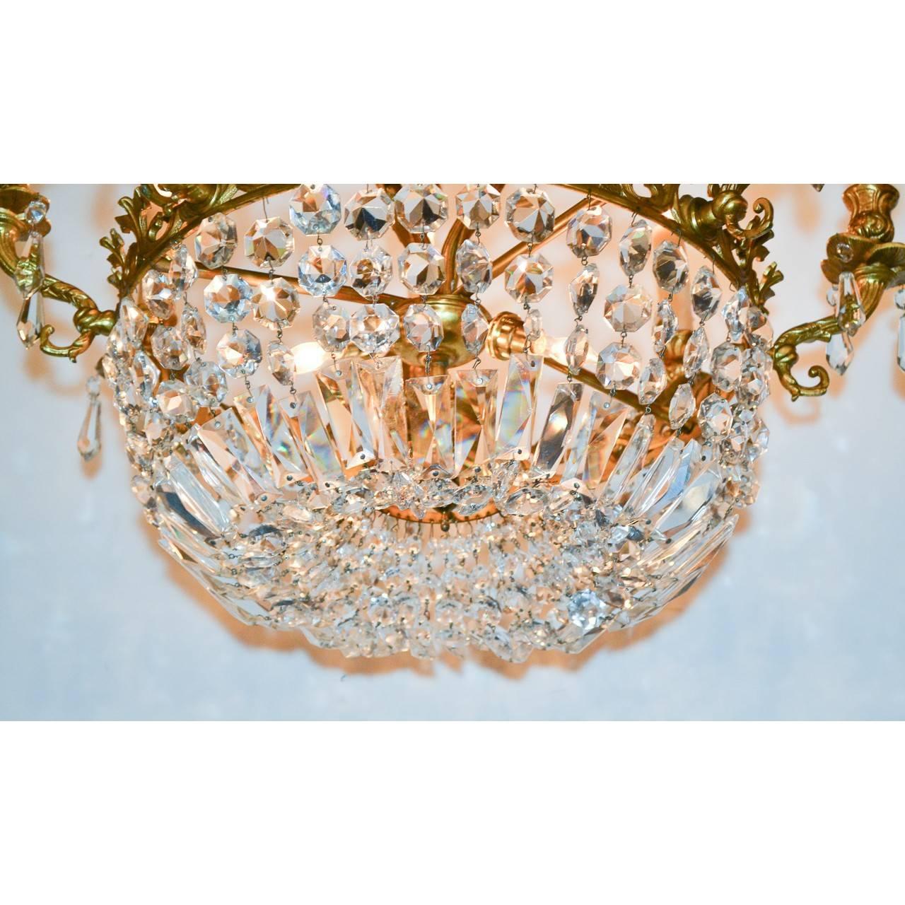 Stunning French bronze chandelier with basket of beautiful cascading crystals,
circa 1920.
