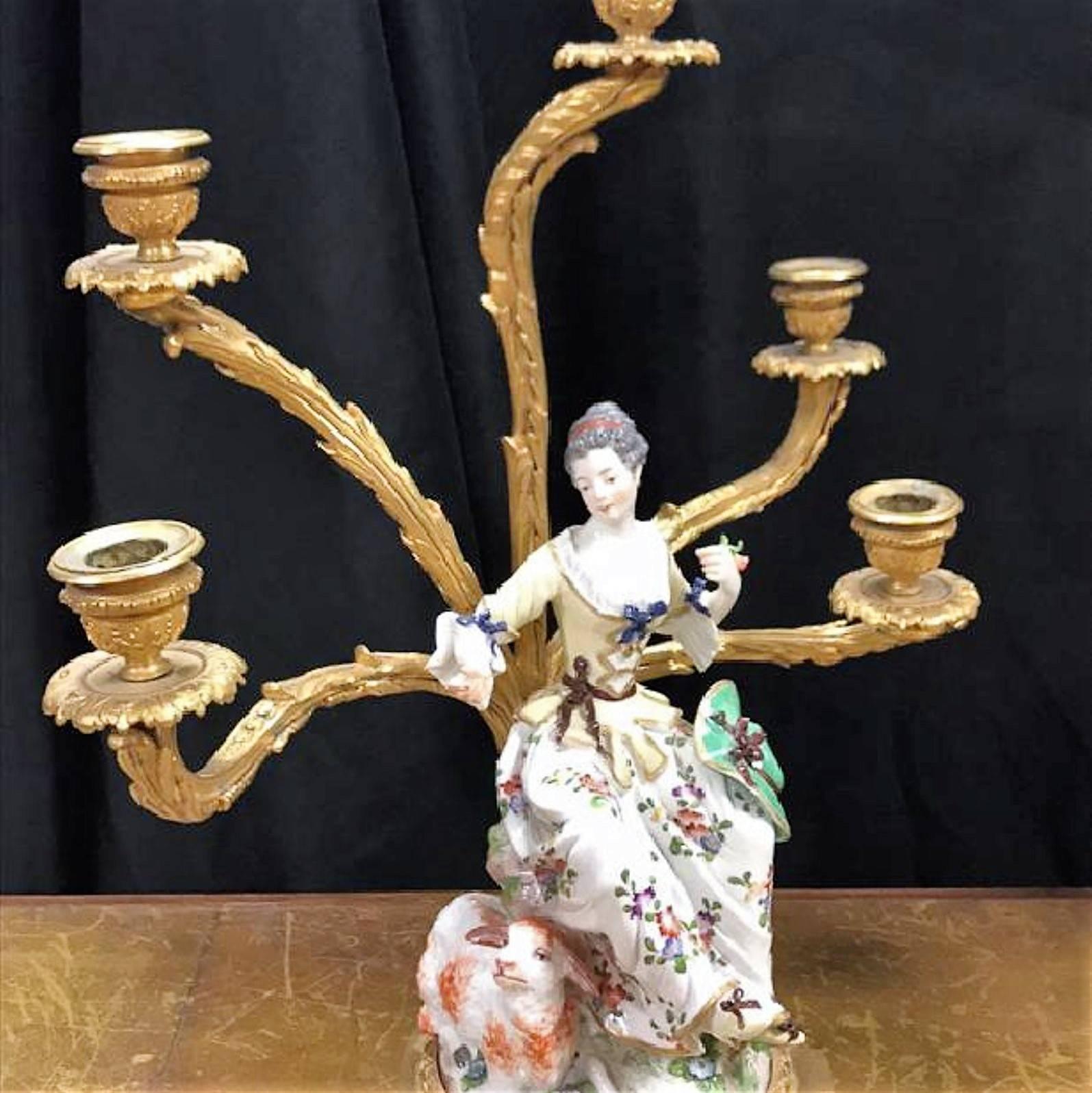 These are Magnificent!

Pair of early Meissen porcelain figurines fitted as bronze candelabra.

The highly detailed figures of paramours colorfully decorated and dressed in classic romantic garb are mounted upon gold washed bronze footed bases