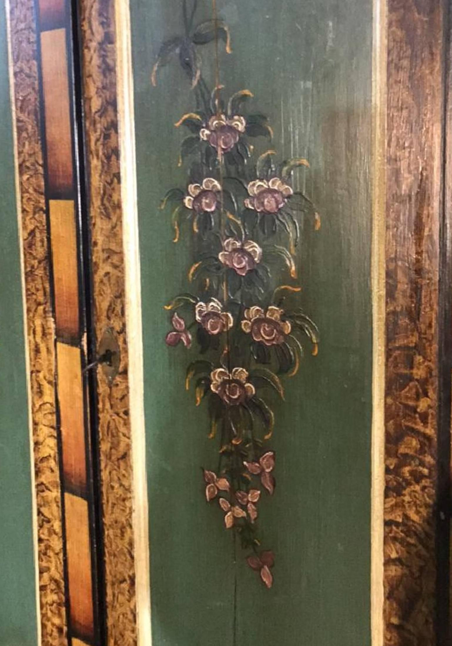 Rare piece indeed!

Fabulous 18th century Swedish carved and painted corner cabinet with uniquely shaped cornice atop double doors painted with greens leaves and pink flower festoon.

The lower two drawers painted with floral swags.

The whole