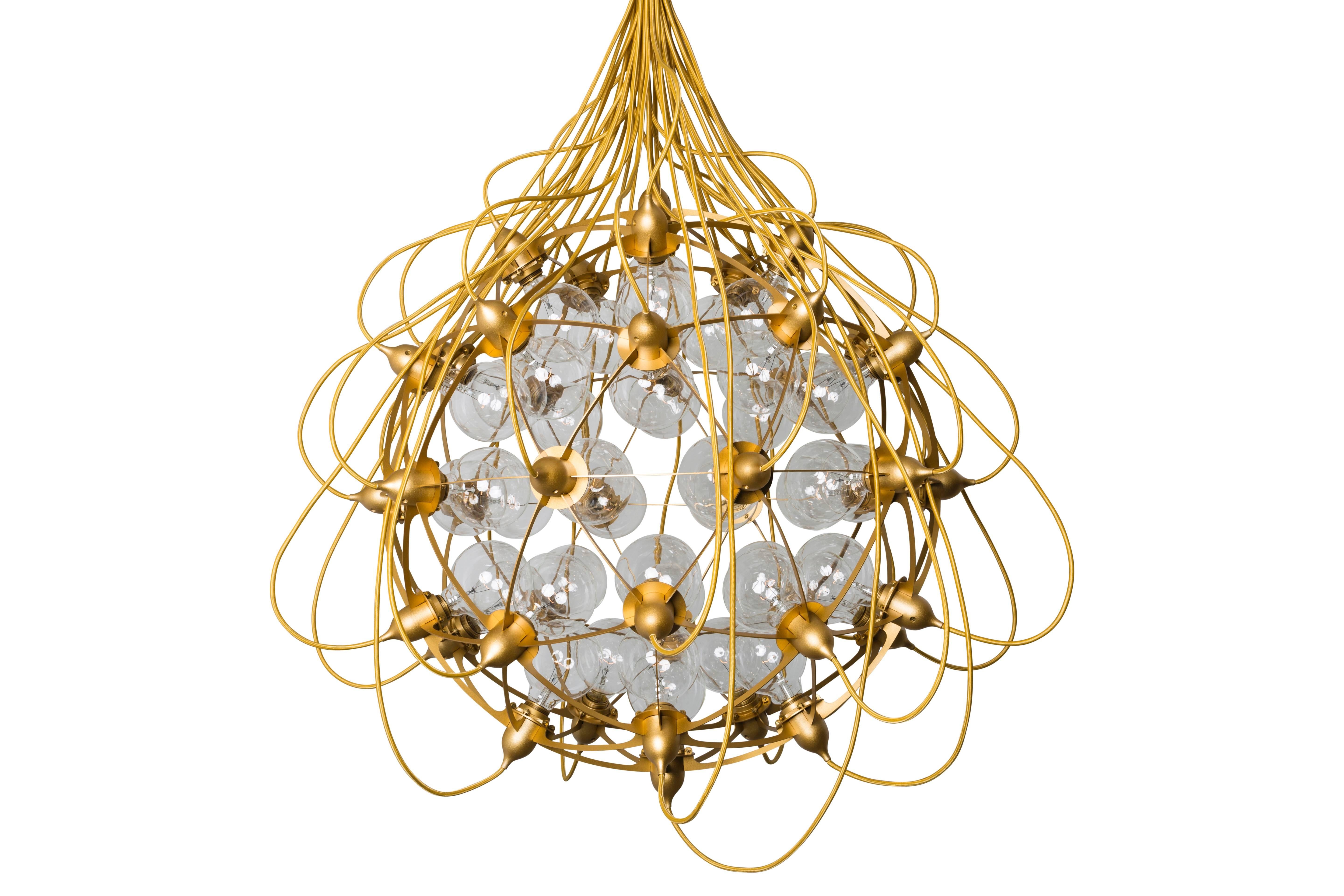 As its name suggests, “The Birth Gold” lamp is inspired by a moment of conception, specifically the moment when the sperm fertilizes an egg. The chandelier is inspired by the delicate electrical current emitted at the moment of fertilization. Its