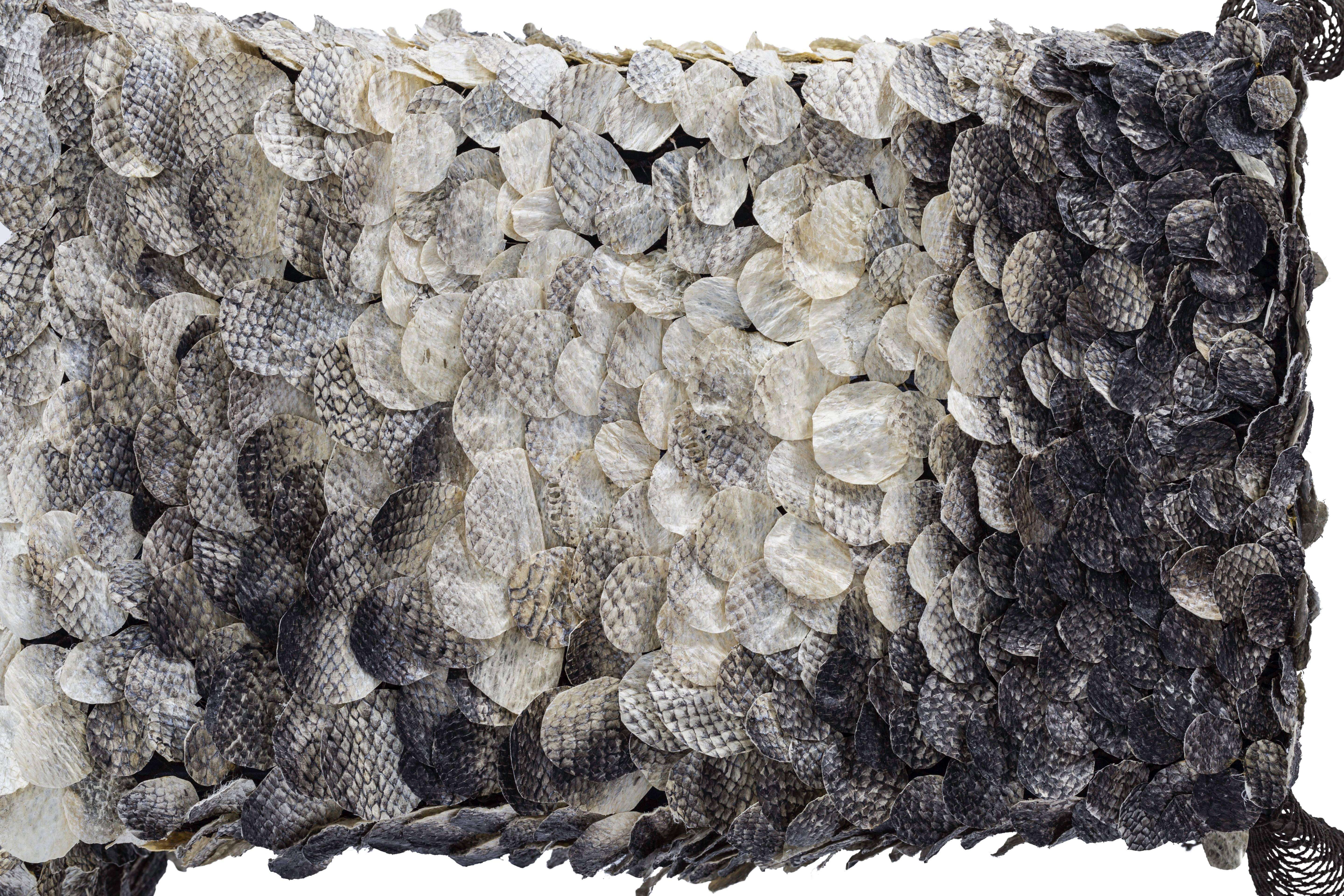 Hoogvliet’s “Re-Sea Me” is a rug made from the discarded skins of salmon, collected as wasted by-products from the local fish shops in her area. By tanning the discarded fish skins and treating them without chemicals, Nienke produced a strong,