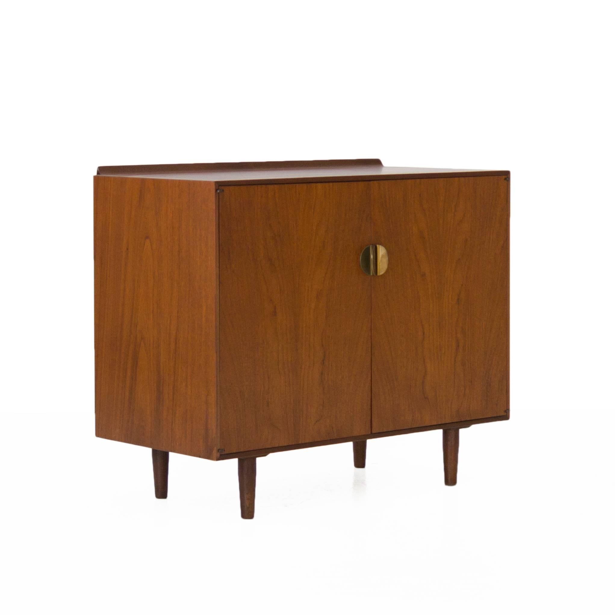 Finn Juhl for Baker cabinet with two doors and drawers part. Produced by in 1952. Signed with Baker tag inside.