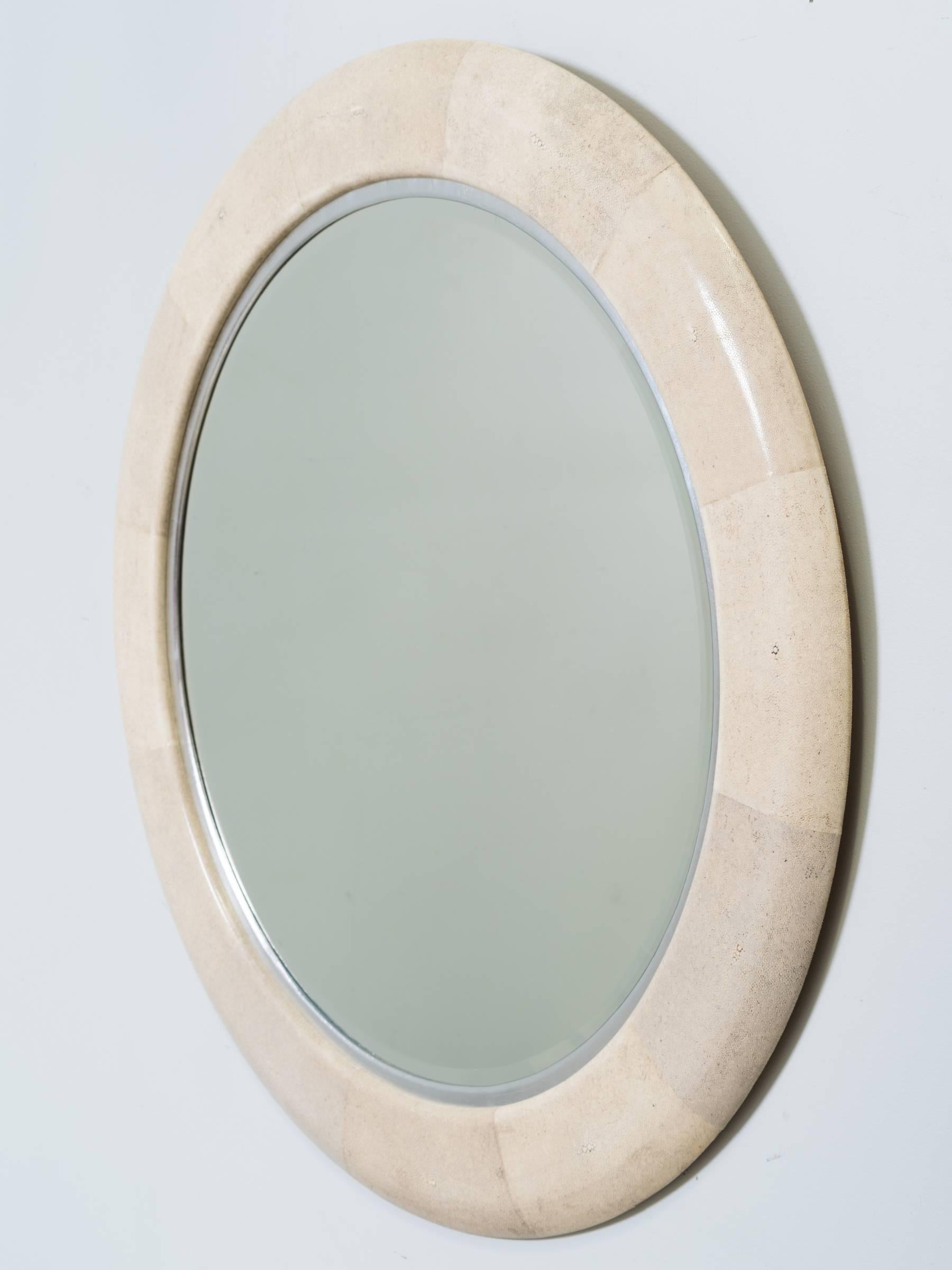 The Alice glass mirror is 12 sections of shagreen with a silver leaf rim, designed by Bill Sofield for Baker.