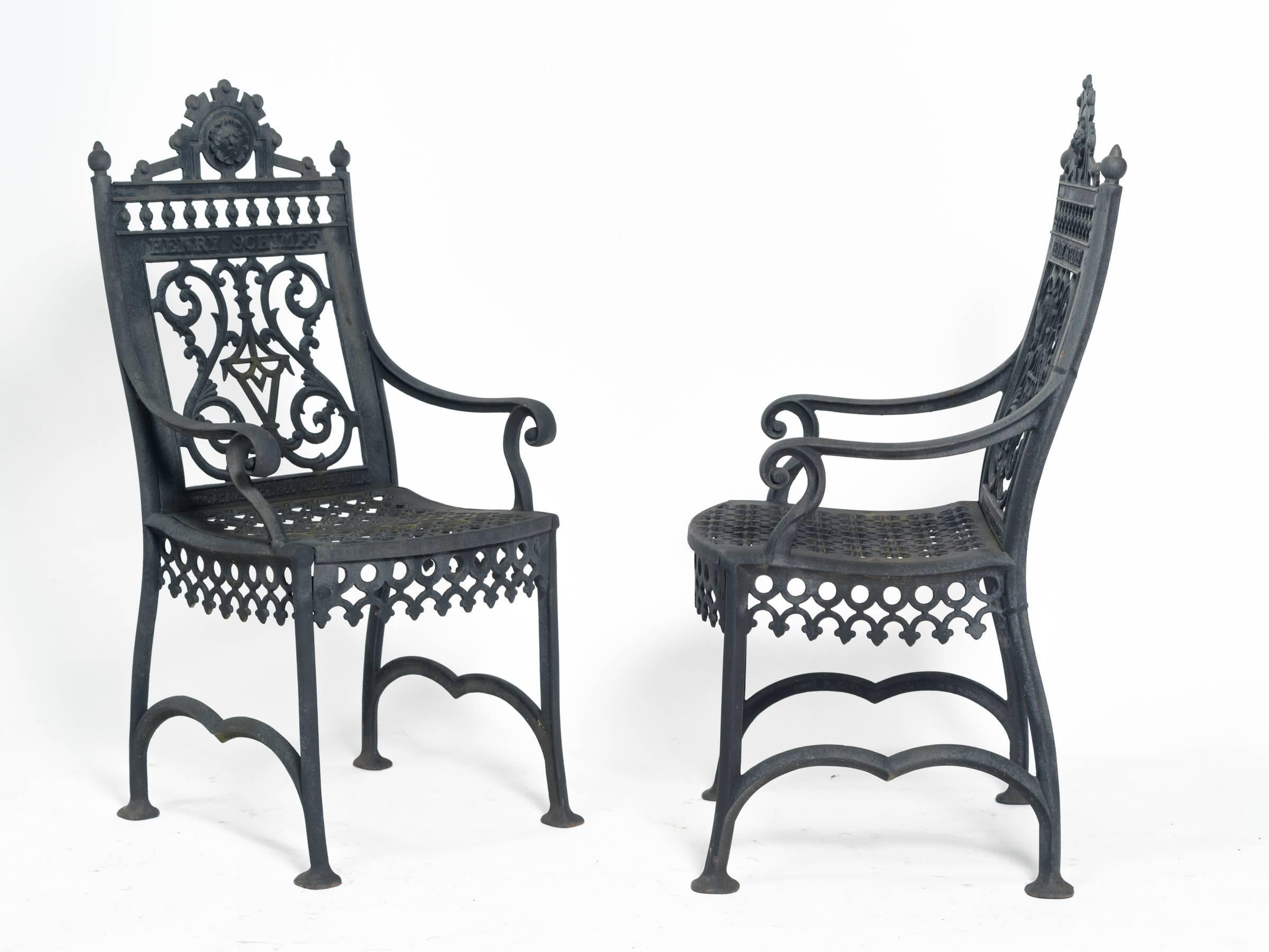 Decorative pair of heavy iron chairs with the deceased name inscribed on each chair. These chairs were used by grievers to sit by the grave when visiting their loved ones.