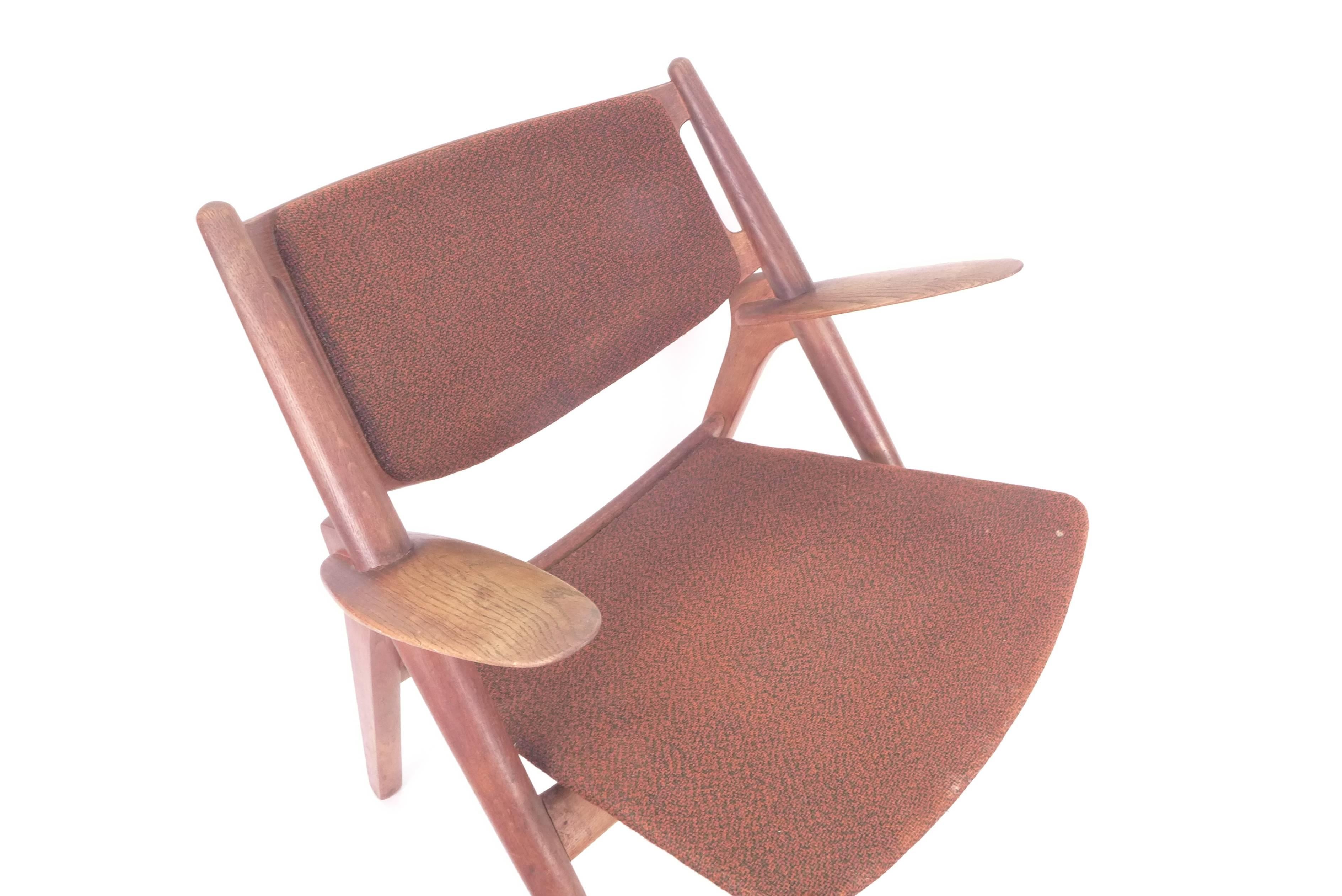 Sawback easy chair model no. CH-28 designed in 1951 by Hans J. Wegner for Carl Hansen & Søn. Solid oak and wool.
Probably manufactured during the 1950s.