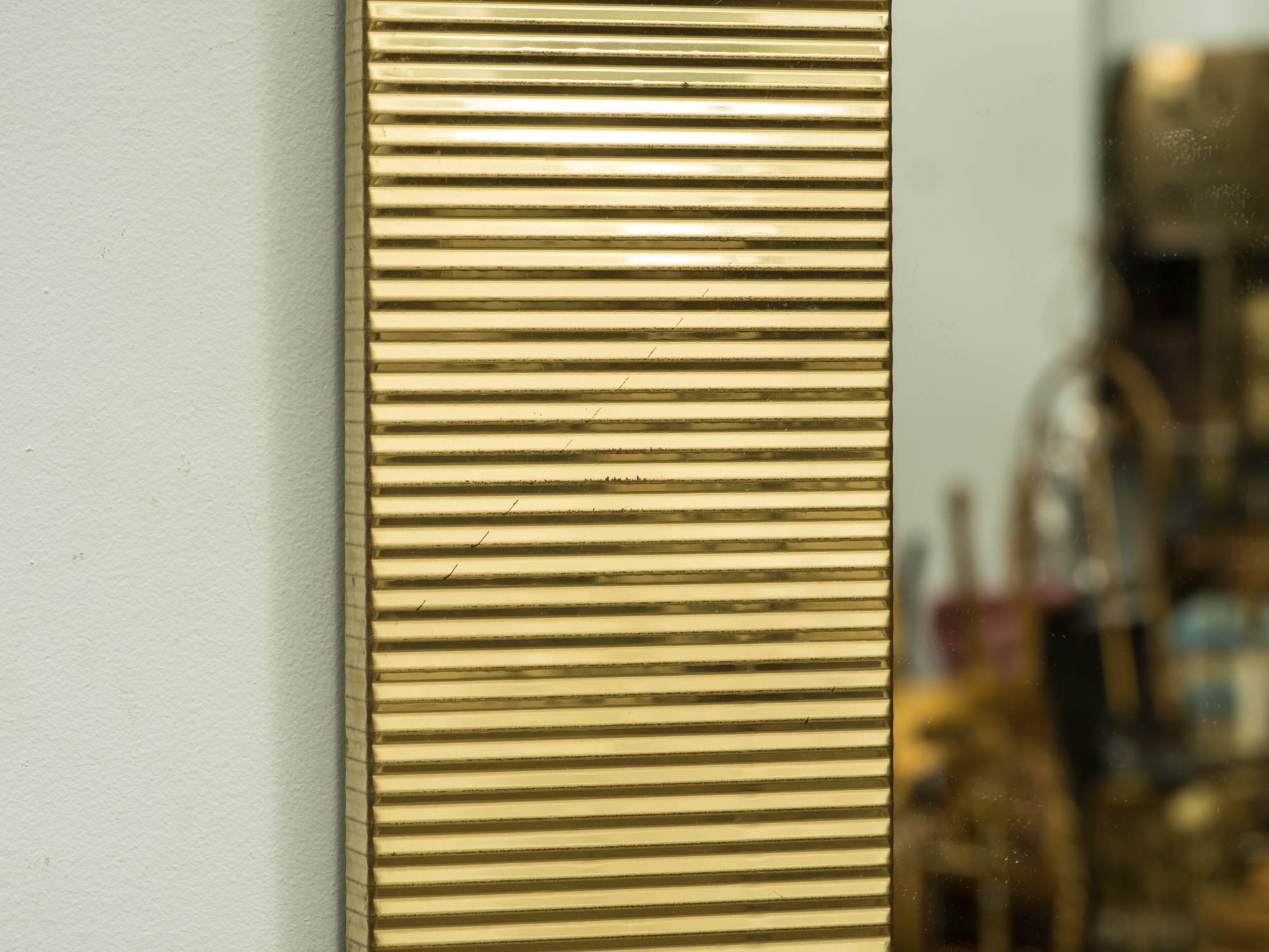 1970s brass ribbed mirror.