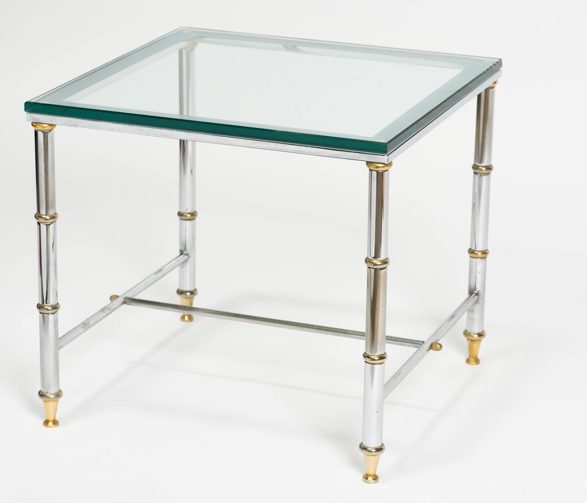 Pair of chrome and brass accent tables with new glass.
 