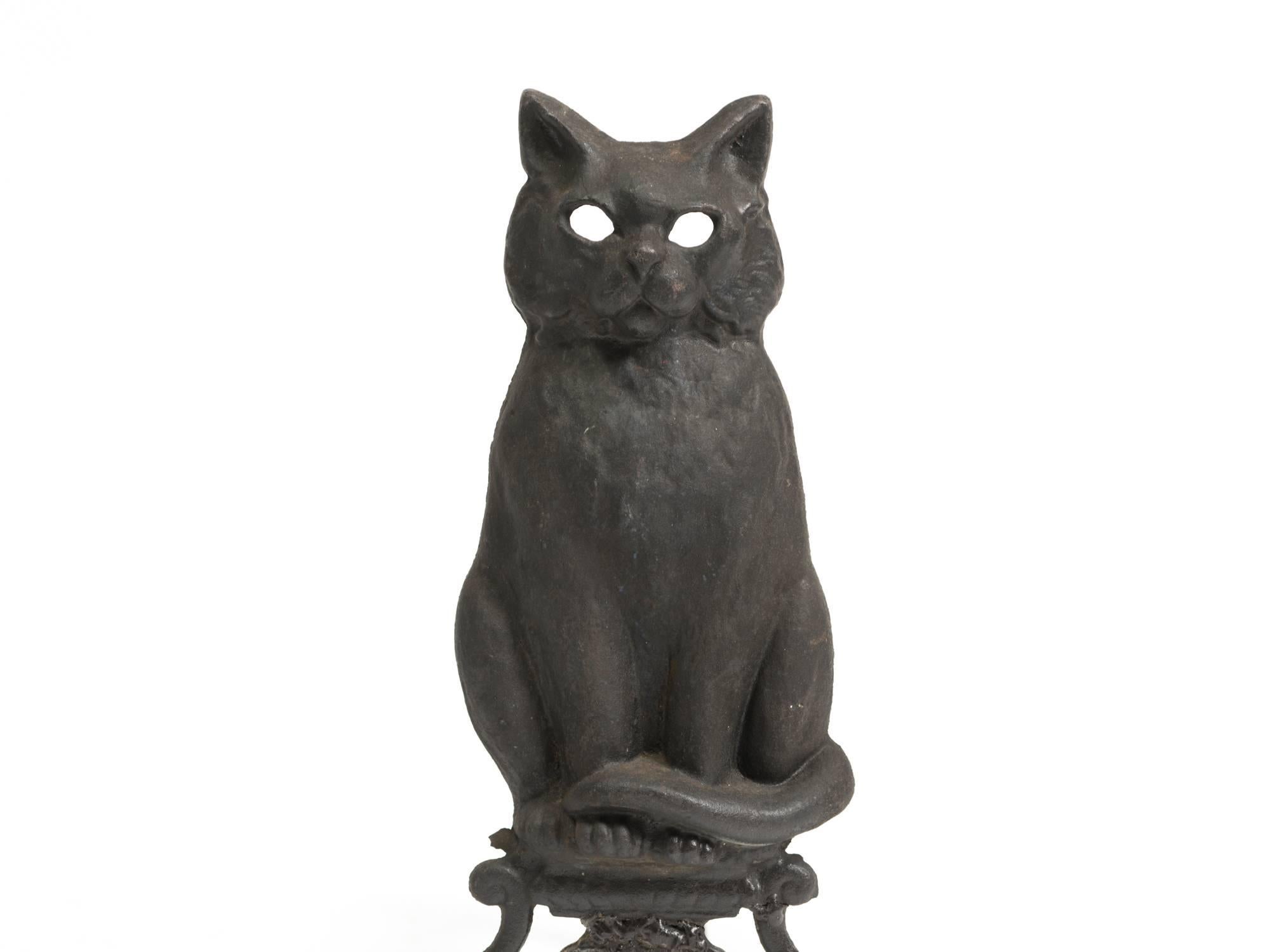 Turn of the century perched cat andirons.