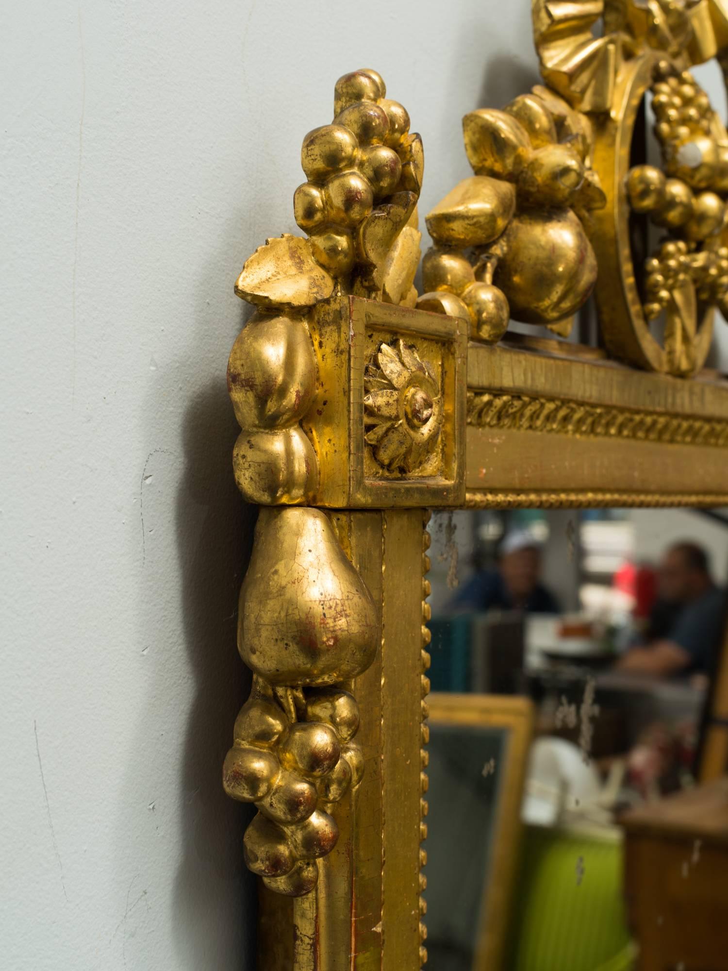 19th century carved wood gilt mirror.