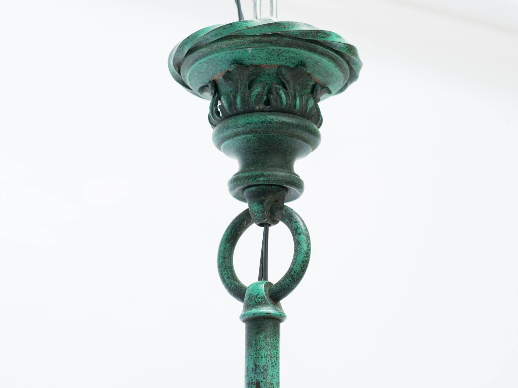 1920s bronze floral lantern with  patinated painted finish.
Chandelier has been rewired.