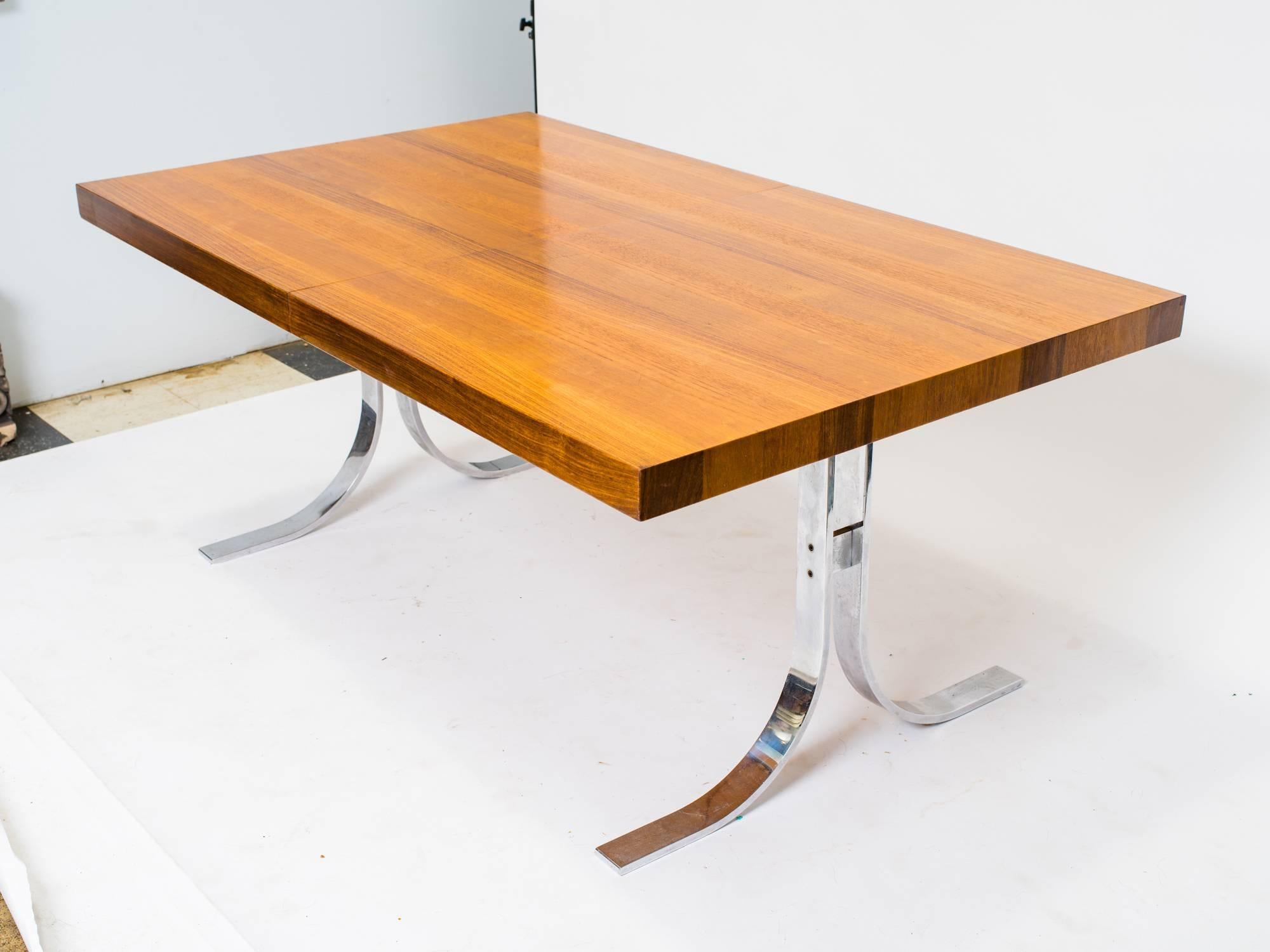 Dyrlund dining table with steel base.
