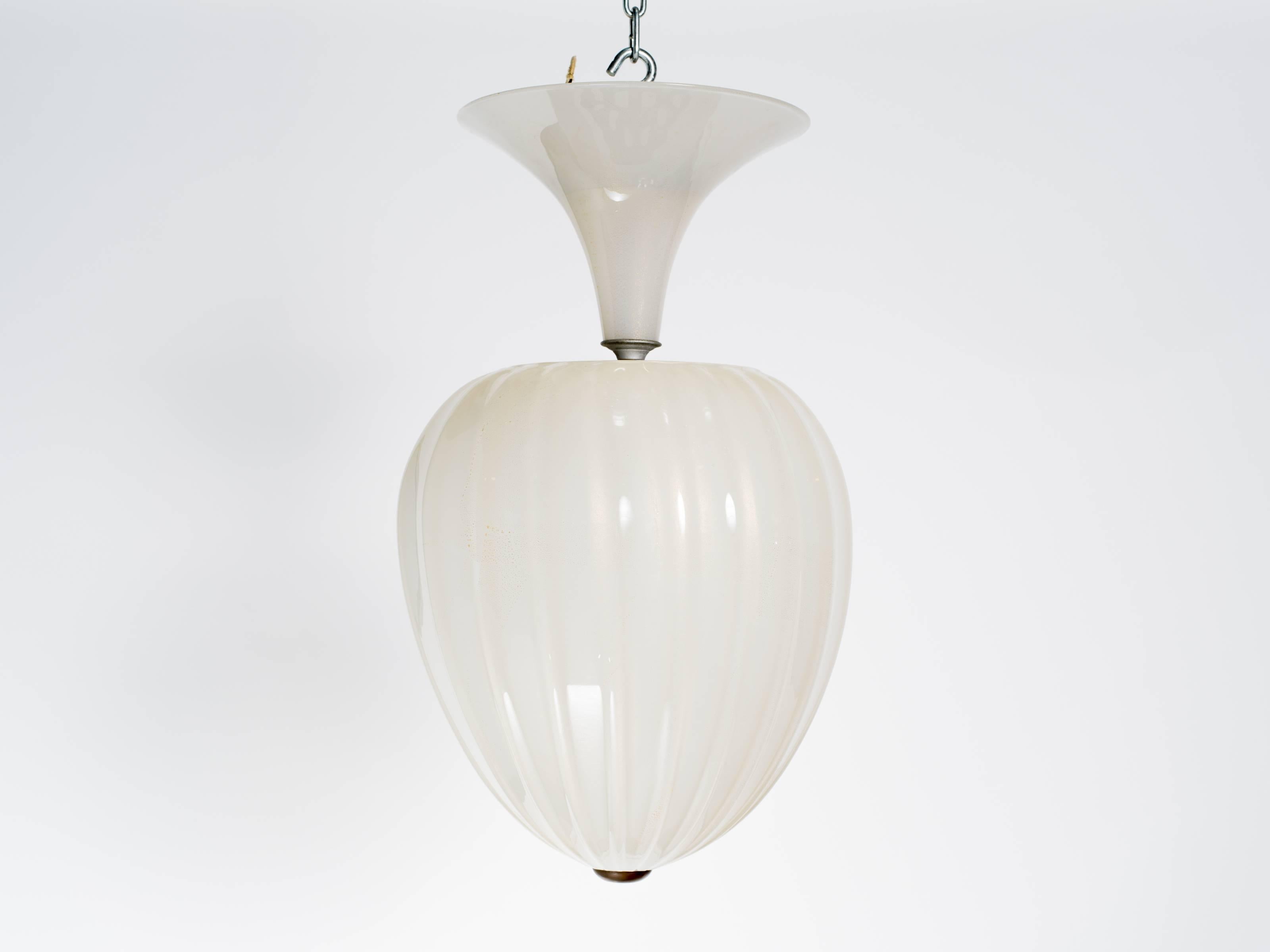 Stunning 1940s Seguso white with gold flecks  Murano glass teardrop  light fixture.White with gold flakes. Proffesionaly rewired. Has 3 sockets, each socket can hold a 100 watt bulb.  The pictures don't do it justice.
