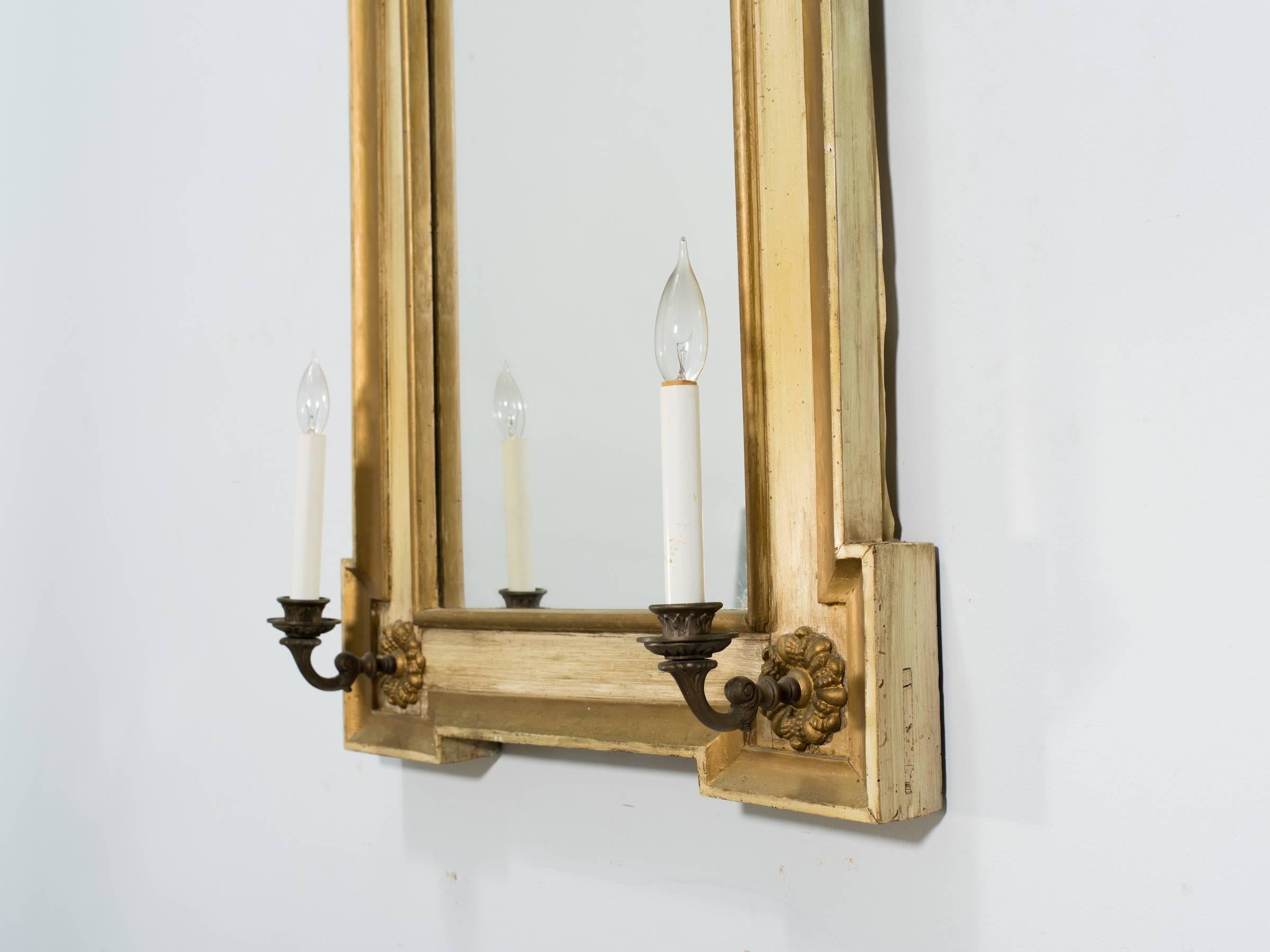 19th century French painted mirror with sconces.