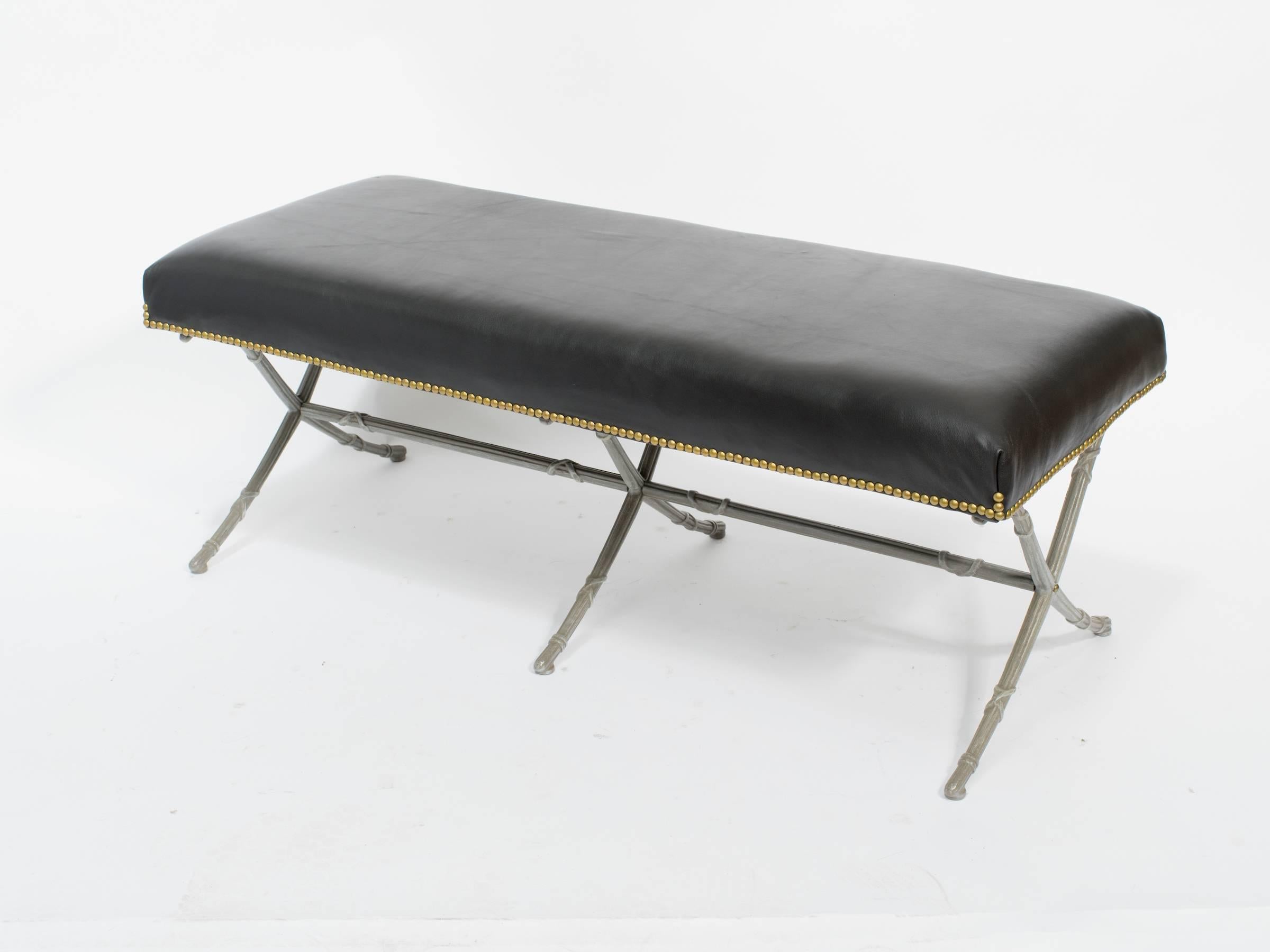 1960s classical leather bench on metal base.